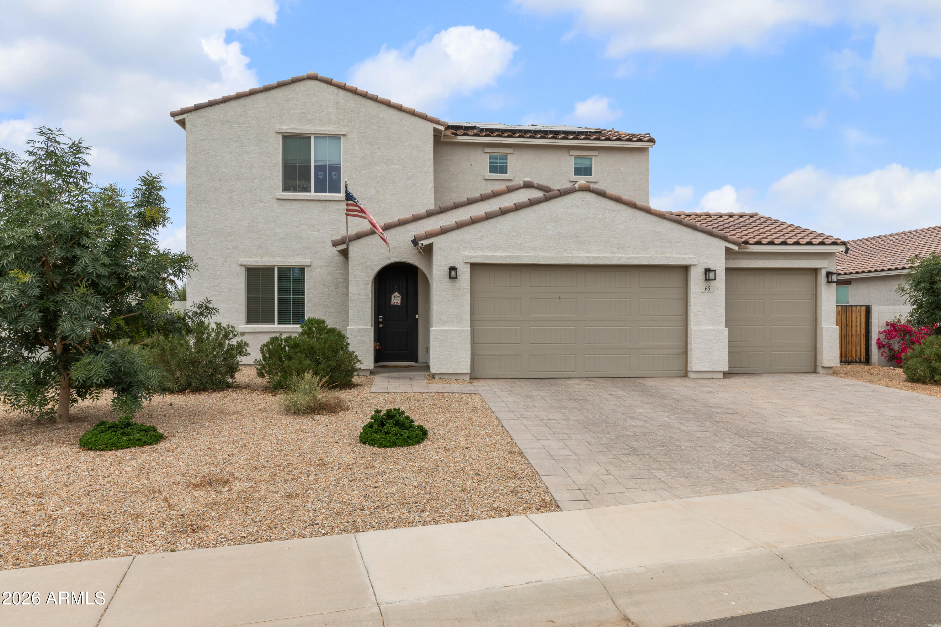 Beautifully maintained 3 year old, single-owner home in Casa Grande offering 4 bedrooms, 3 bathrooms, and a spacious 3-car garage. Situated on an oversized 12,000+ sqft lot, this property features stunning mountain views and owned solar with a Tesla Powerwall 3 battery -virtually eliminating electricity costs-plus bird-blocked panels for added protection. Enjoy a functional layout with a full bedroom and bathroom on the main floor, perfect for guests or multi-generational living. The home has been immaculately cared for and still feels like new. Additional highlights include an RV gate, Tesla Level 2 car charger , soft water loop and water softener, and ample outdoor space with endless possibilities. A rare combination of efficiency, space, and pride of ownership--this one is a must see!