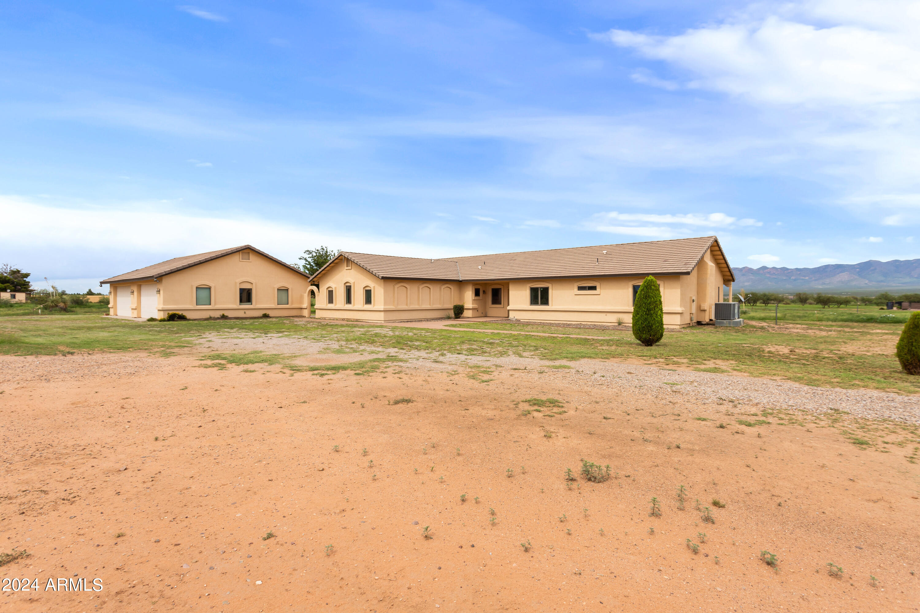 The seller is open to offering a carpet allowance if the appropriate conditions are met. This exquisite property, set on 4 sprawling acres, is a true horse lover's paradise. Boasting recent updates and breathtaking mountain views, this home offers the perfect blend of modern comfort and rural charm. The kitchen and partial flooring were updated in 2024, alongside a partial bathroom update the same year, and partial plumbing updates in 2023. Enjoy the expansive wrap-around patio, perfect for entertaining or relaxing. The large detached 4-car garage provides ample space for vehicles, with additional storage for tools and equipment. This home is a perfect blend of style, functionality, and outdoor living. Don't miss the chance to own this turnkey gem!
