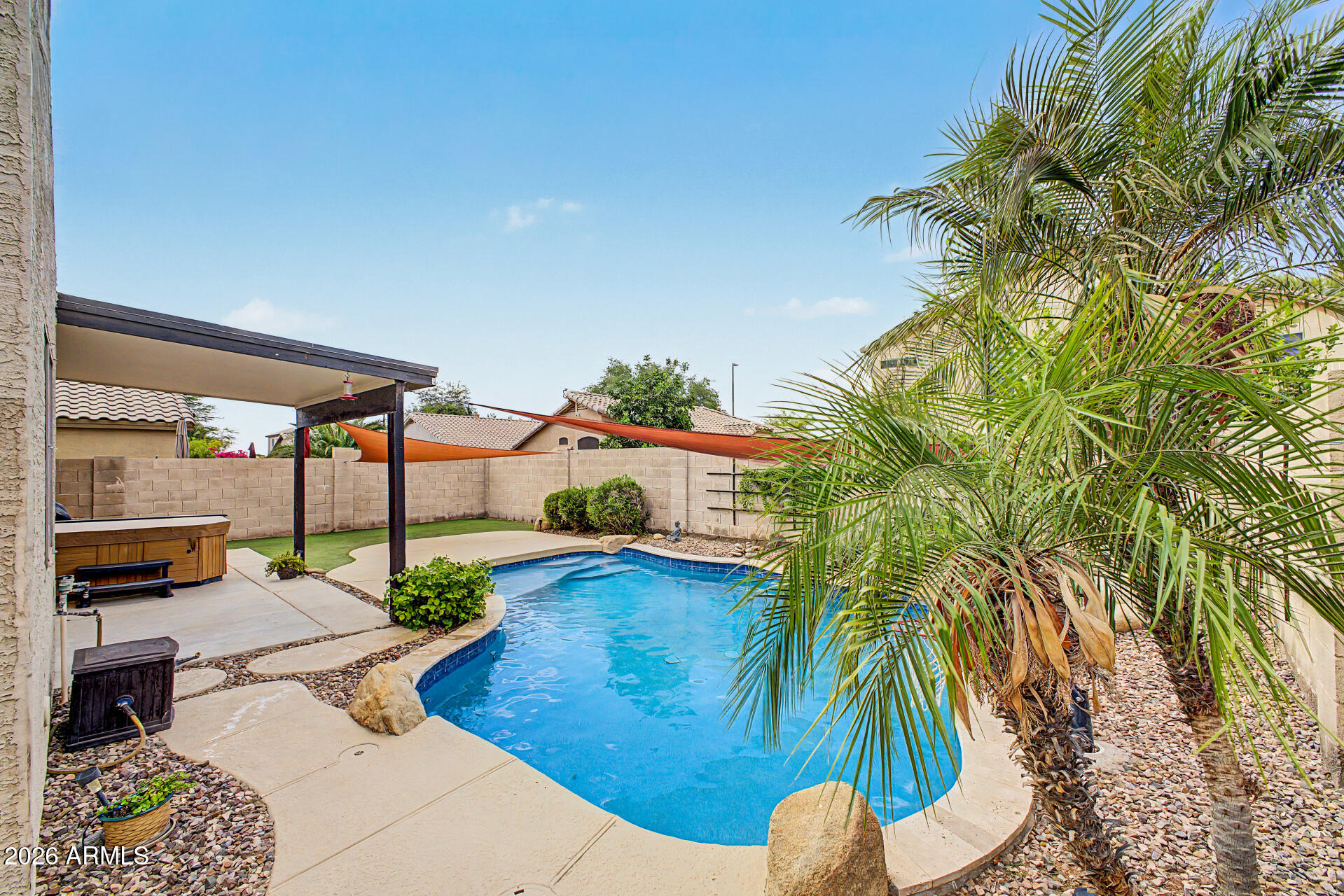 Welcome home to this beautifully updated residence nestled in a highly desirable community, centrally located near shopping, dining, entertainment, and freeways. Offering four spacious bedrooms, loft and two-and-a-half bathrooms. This home provides the perfect blend of comfort, style, and functionality. Step inside to discover luxury vinyl flooring in all the right places, a stunning wood accent wall, and a custom built-in entertainment center that creates a warm and modern living space. The thoughtfully updated kitchen is sure to impress with white cabinetry, granite countertops, stainless steel appliances, and a gorgeous designer backsplash. The backyard is your own private retreat, featuring a beautiful blue sparkling PebbleTec pool, artificial turf and above ground spa. Upstairs and downstairs living areas provide plenty of room to relax, work, and entertain. The spacious primary suite and secondary bedrooms offer flexibility for families, guests, or home office needs. This sought after community offers tennis courts, playgrounds, and lush greenbelt areas. Perfect setting for an active lifestyle. With tasteful updates throughout and an unbeatable location close to everything, this move-in-ready home is one you won't want to miss!