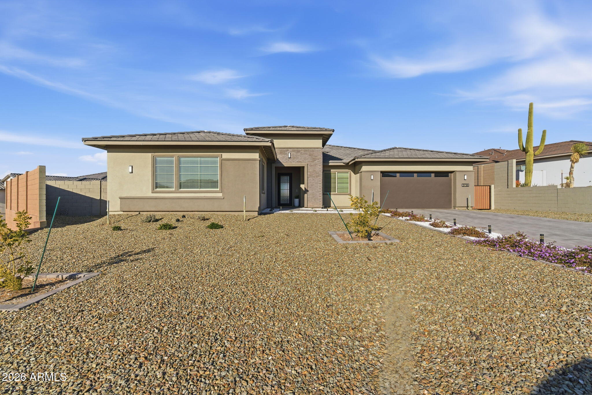 What an incredible premium hillside lot in the beautiful Whispering Hills neighborhood at the base of South Mountain! This Pinnacle Floorplan has over 3600 SF w/4 Bedrooms & 3.5 Bathrooms. Split Bdrms & Home Office. Seller paid for all the right PREMIUM features... Soaring 12' ceiling w/CORNER Sliding Glass Door out to patio, Modern Iron Front Door, Added Exercise/Bonus Rm, Upgraded Flooring, Custom Tile Master Shower w/Raincan Head & Frameless Walk In enclosure. Gourmet Kitchen includes upgraded Cabinets & Quartz Countertops, Beverage Center, Premium Cafe' GE Appliance Pkg: 36'' Gas Cooktop, Double Ovens & Commercial S/S Vent. Champagne Bronze TOUCH Kitchen Faucet & Pot Filler. Baths have Matte Black Fixtures w/raised Vanities & Rectangle sinks for a modern look. Make this your new HOME! Added Upgrades:

12" Ceiling Height in Great Room       
Contemporary Iron Front Entry Door w/Lever Matte Black Hardware   
Finished Bonus Exercise/Game Room 
Extended Corner Sliding Glass Door
Upgraded Aristokraft Cabinets Throughout
Grade 5 Quartz Countertops
Cafe' GE Appliance Package
36" Cafe' Gas Cooktop
Champagne Finish Pot Filler
Super SingleBowl Kitchen Sink
Champagne Finish TOUCH Faucet
Beverage Center
Commercial 36" S/S Vent
Custom Shower Tile Surround w/ Frameless Walk In Shower Enclosure
RainCan Shower Head with Watersense & Sep Valves
Raised Vanities all Baths w/ Rectangular Vanity Sinks
Matte Black Bath Plumbing Fixtures
Soft Water System
Gas Line Stub out for Backyard
Premium Oversized Hillside Lot (.46 Acre)
Insulated Garage Door
Prewire for Pendant Lights
Ceiling Fans & Prewire w/Sep switch for Fan & Light
Full house Window Blinds 
Floor outlet in Great Room 
Additional Outlet
10' RV Gate
   

Standard features are: 

400 AMP Electrical Panel

SMART Features: Switches, Thermostat, Front Entry Door, Doorbell & Garage Door Opener.   LED Disc Lighting per Plan, USB Port @ Kitchen & Primary Suite with Duplex Charger.

Energy & Earth Friendly features:
LEED Certified Home, 16 Seer Lennox Air Conditioner System, Fresh Air Intake & R8 Flex Duct System, Tankless Gas Water Heater, Low E Dual Pane Vinyl Frame Windows, Sprayed Cellulose Insulation in Exterior Wall, Low Water Plumbing Fixtures & Toilets, Post Tension Foundation System.

All Interior paint to be Low VOC