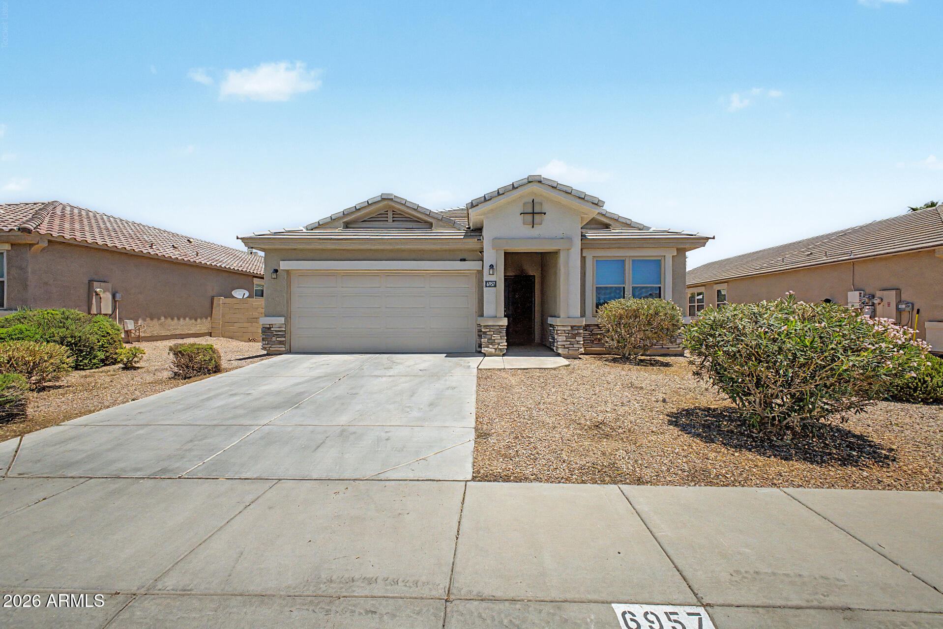 Welcome to this beautiful 4-bedroom, 2-bath home featuring a split floor plan and open-concept living. The spacious primary suite includes a private sitting area, dual sinks, and a large walk-in closet. Enjoy a stylish kitchen with smoky pearl granite countertops, espresso cabinets, stainless steel appliances, and bar seating. Low-maintenance desert landscaping front and back, plus an assumable solar lease to help reduce utility costs. Don't miss the opportunity to make this beautiful home yours!