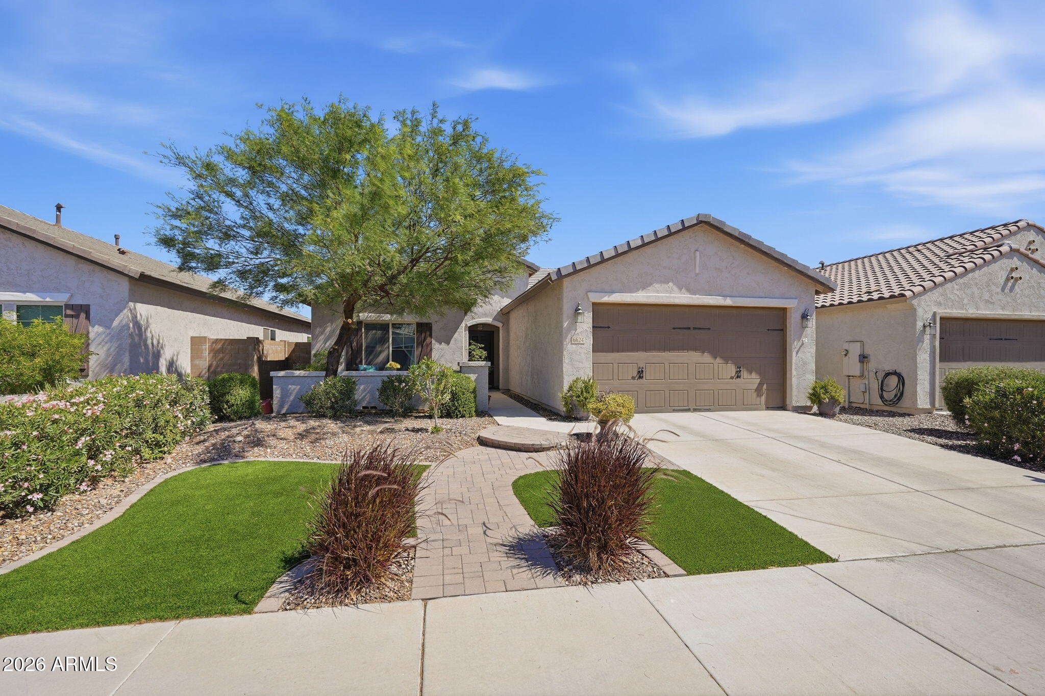 Welcome to your desert retreat in the highly sought-after resort-style golf community of Anthem at Merrill Ranch! Perfectly situated on a premium lot that backs to a walking trail, this beautiful home offers privacy, comfort, and access to an unmatched lifestyle filled with amenities designed for both relaxation and recreation. This home features a charming front courtyard and  a kitchen with white staggered cabinetry with soft-close drawers and gleaming granite. Come experience the lifestyle, the community, and the place you'll be proud to own as your home. A charming front courtyard greets you in the front, the front yard is enhanced with attractive brickwork and low-maintenance landscaping, creating a welcoming and polished curb appeal.
  Living in Anthem at Merrill Ranch means more than just owning a home--it's about embracing a lifestyle. Residents enjoy access to a wide array of resort-style amenities, including a golf course, a heated community pool, state-of-the-art fitness center, workout room, and multiple sports courts for pickleball, tennis, and basketball. The community also features scenic lake parks, walking and biking trails, and beautifully maintained green spaces that invite you to stay active and connected.
    Come experience the lifestyle, the community, and the place you'll be proud to own as your home.
Upgrades:
*Soft water loop installed
*Soft close kitchen drawers
*Front Courtyard
*Brick throughout landscaping
*Front & Back professionally landscaped
*Granite counter tops
*Staggered Kitchen Cabinets
*Stainless steel appliances
*Garage shelves mounted to the ceiling
*Back patio wired for fan
*Surround sound wired
*Gas stub in backyard
*Tankless hot water heater
* BACKS TO WALKING TRAIL
*Consistant gray tile flooring
*Garage extension