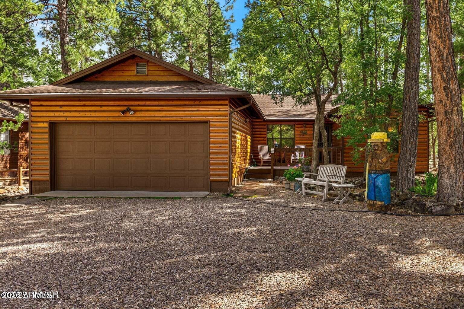 An inviting front porch welcomes you home, while the large covered back deck overlooks a beautifully landscaped yard with a serene mix of mature trees providing summer shade and natural privacy. Tucked away in the tall pines of Pineridge, this beautifully maintained 3 bedroom, 2 bath, 1,479 sq ft log-sided home sits on two tax lots totaling 0.51 acres, offering space, privacy, and a true mountain feel.  Inside, enjoy flowing hardwood floors, tongue-and-groove ceilings, and a cozy fireplace that opens seamlessly to the dining area and kitchen. The kitchen features custom cabinetry, granite countertops, and abundant storage. The primary suite includes a walk-in shower with safety bars and a large sliding glass door for easy access, while guest bedrooms share a spacious bathroom. Located in a peaceful community ideal for enjoying the mountain lifestyle, this oversized double lot offers a rare blend of comfort, charm, and outdoor living. The Pineridge community in Pinetop-Lakeside, AZ is a well-established, primarily residential subdivision nestled in the cool, forested White Mountains, known for its tall ponderosa pines, peaceful mountain setting and privacy. It's a gated neighborhood with an active community association, modest annual dues, and privately maintained roads that help preserve a quiet, wooded atmosphere while still being convenient to the amenities and outdoor recreation that make Pinetop-Lakeside desirable. Homes in Pineridge are often surrounded by mature trees and spacious lots, offering a sense of seclusion yet easy access to hiking, fishing, golf and the year-round seasonal activities the area is known for. The community is served by the Blue Ridge Unified School District and reflects the broader mountain lifestyle -- comfortable, relaxed, and deeply connected to the natural surroundings of northern Arizona.