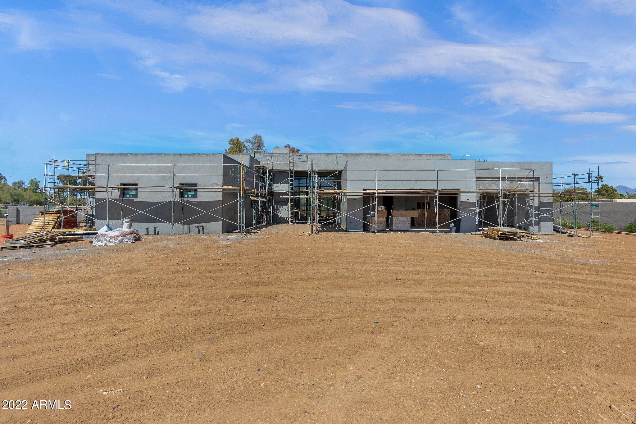 BRAND NEW CONSTRUCTION IS THIS SINGLE-LEVEL HOME, DESIGNED AND BUILT BY CULLUM HOMES. IRONWOOD GOLF VILLAS IS AN EXCLUSIVE COMMUNITY OF ONLY EIGHT CUSTOM HOME SITES. EACH SITE OFFERS ONE A HIGHLY DESIRABLE IN-TOWN LOCATION WITH ABUNDANT ROOM FOR A CUSTOMIZED ESTATE HOME. THIS PARTICULAR SITE OFFERS YOU SWEEPING VIEWS OF THE CAMELBACK COUNTRY CLUB GOLF COURSE, AS WELL AS VIEWS OF THE SURROUNDING MOUNTAINS. 4334 SF OF LUXURY LIVING SPACE WITH 4 BED + OFFICE, 4.5 BATH, AND A 3-CAR GARAGE. CONTEMPORARY UPGRADED FEATURES AND DESIGNS ALL THROUGHOUT. VERY SPACIOUS OPEN FLOOR PLAN.  ALL STAINLESS-STEEL, TOP-OF-THE-LINE APPLIANCES IN THE KITCHEN. ALL BEDROOMS HAVE OWN EN-SUITE BATH AND WALK-IN CLOSETS. COMMUNITY IS GATED FOR EXTRA PRIVACY AND SECURITY. LOCATED JUST MINUTES AWAY FROM OLD TOWN SCOTTSDALE, PARADISE VALLEY, AND FASHION SQUARE MALL, OFFERING PLENTY OF OPTIONS FOR SHOPPING, RESTAURANTS AND ENTERTAINMENT.