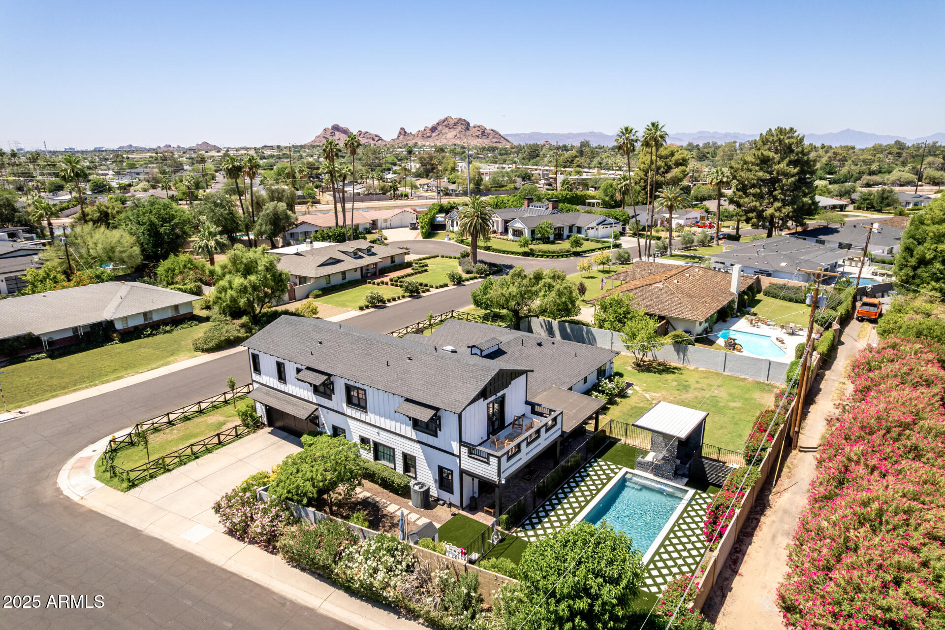 THE BEST DEAL IN ARCADIA PROPER!! LIVES LIKE A SINGLE LEVEL!*OVER 4200 SQFT, 6 BED, 5.5 BATH, ON OVER 1/3 ACRE CORNER LOT*STUNNING COTTAGE STYLE DESIGNER HOME*FORMAL DINING*FAMILY ROOM W/FP*GOURMET KITCHEN WITH S/S DACOR APPLIANCES, CUSTOM SHAKER CABINETS, 6 BURNER GAS COOKTOP, QUARTZ COUNTERS, ISLAND, & FARM SINK*MASTER SUITE DOWNSTAIRS*MASTER BATH W/TUB & GLASS SHOWER*3 OTHER BEDROOMS DOWNSTAIRS*UPSTAIRS HAS A MEDIA/GAMEROOM & 2 BEDROOMS W/OWN BATHS & STUNNING CAMELBACK & PAPAGO VIEWS!*UPSTAIRS IS PERFECT FOR TEEN SUITE OR MULTI-GENERATIONAL LIVING*EXCEPTIONAL FINISHES INCLUDING CUSTOM FIXTURES, CROWN MOLDING,SHIPLAP WALLS, TONGUE & GROOVE CEILINGS, & WOOD BEAMS*2025 BACKYARD W/POOL,BAJA STEP,JACUZZI, WATER FEATURE,TURF,BULIT-IN BBQ, MISTERS, & LARGE GRASS  AREA*A PERFECT 10 IN ARCADIA!
