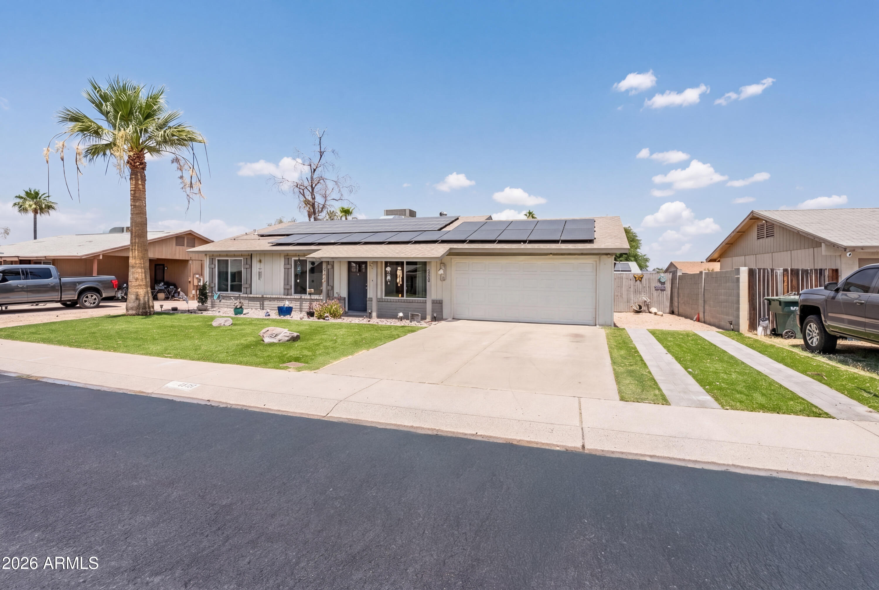 Discover this beautifully maintained home with NO HOA, a brand-new roof installed May 2026, and a solar lease for added energy efficiency! Ideally located just minutes from Cave Creek, shopping, dining, and the Loop 101 Freeway, this move-in ready home offers convenience and comfort. Inside, enjoy bright open living spaces with abundant natural light, wood-look flooring, and a neutral color palette. The kitchen features shaker-style cabinetry, quartz countertops, a breakfast bar peninsula, tile backsplash, and stainless steel appliances. The primary suite includes a private ensuite bath. The backyard boasts a covered patio, brand-new turf, paver seating area, and ample space to add a pool, BBQ area, or create your own outdoor retreat. A fantastic opportunity with major updates completed!