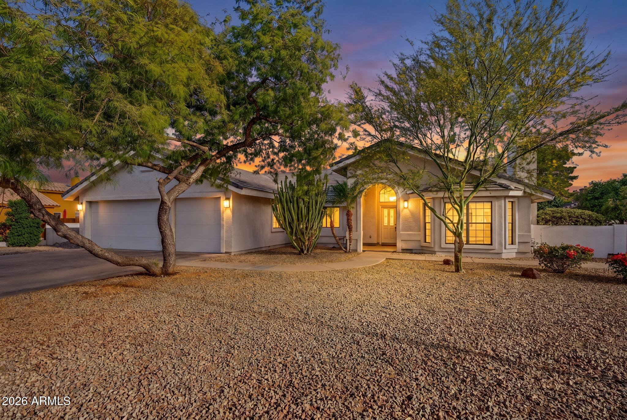 Beautifully updated single level home with No HOA in North Mesa!  Completely remodeled in 2017.  Primary bathroom remodeled this year.  Spacious master suite features fireplace, large sitting room, double sink vanity, walk-in closet, free standing tub and separate shower with gorgeous tile. Kitchen has plenty of storage, island, and additional recessed lighting.  Cozy wood look tile in the main living area and bathrooms. Out back features a MASSIVE covered patio with built-in barbecue. Detached air conditioned and insulated building that can be a guest house, office, or gym. Roof done in 2018. How about your own 18 fruit trees?!!! East side has a double gate with slab for boat or camper.  West side has a large play area.  Cap it off with a 3 car garage and this is a true North Mesa gem!