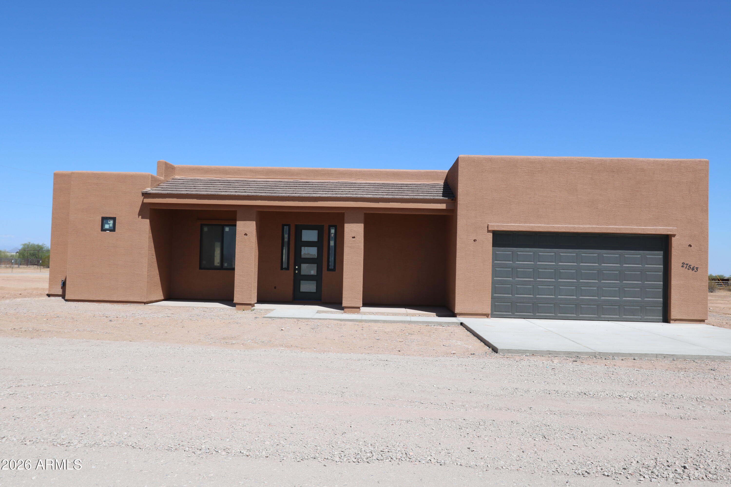 Brand New home built to perfection! Home is open & bright w a touch of contemporary finishes & custom front door. Kitchen is fantastic w/ island breakfast bar covered in level 3 granite or quartz. 2x6 exterior wall construction, Andersen Windows, SIGA house wrap and tape system,spray foam insulation, & loaded w many more upgrades. Bedrooms are spacious w/ master having walk in closet & w huge walk in shower. Fantastic split floor plan w awesome mountain views to the north & south. Property is located around upscale site built custom homes w underground power, close to US 60 freeway access a 5 part shared well & No HOA! Others to choose from. HURRY! Bring you horses and your toys! Located in excellent area of Wittmann. Buyer can still choose interiors.  Completion time 60 days