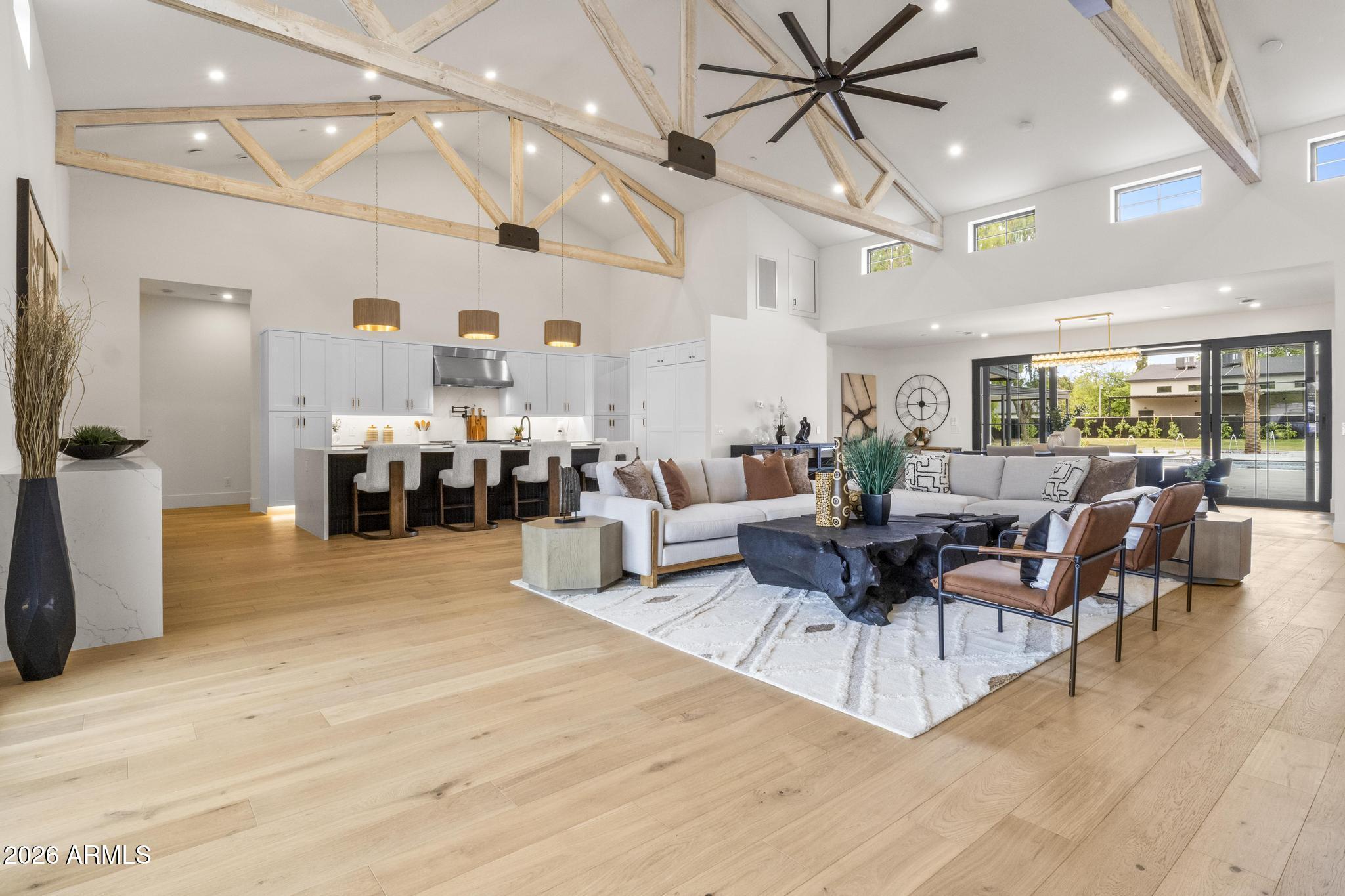 MODERN DESERT MASTERPIECE! Introducing the latest Modern Farmhouse from MAK Homes on nearly 1 Acre in 85254. A welcoming front porch & prominent entry leads to a precisely designed, all-on one-level floor plan with the Kitchen/Great room with clerestory windows & a massive fireplace as its centerpiece. Hardwood floors, and the highest quality windows/doors throughout. The resort-style backyard features a custom Pool/Spa, Ramada, HUGE grassy area, & a stunning Casita, complete with Living, Kitchenette, en suite Bed, & dedicated Pool Bath. Rear yard gate for easy access for future add-ons, flood irrigation + sprinklers. 2 A/C Garages: generous 2-Car and a 1-Car with 15' ceiling for lifts. Horse privileges and plenty of room for stables or an additional garage. Warmth, Sophistication, and Sustainability. Built with a modern interpretation of farmhouse living, the design echoes barn conversion strategies, expansive yet practical spaces, seamless indoor/outdoor flow, and timeless character. The office is ideal for a home business, while the pool house offers independence for guests or multi-generational living. The Metal Roof and Composite Siding means the exterior of this property will last a lifetime. Interior blown-in insulation on the ceilings and inside the walls will mean quieter living, lower energy costs, and a more consist interior temperature.  A Car lover or Equestrian enthusiast? This property enjoys full Horse privileges, let MAK Homes design and build the ultimate Barn and Corral, or a show stopping detached Garage, with room to spare. Steps from Sonrisa Park and just minutes from the redeveloping PV Mall. This is the one you've been waiting for!