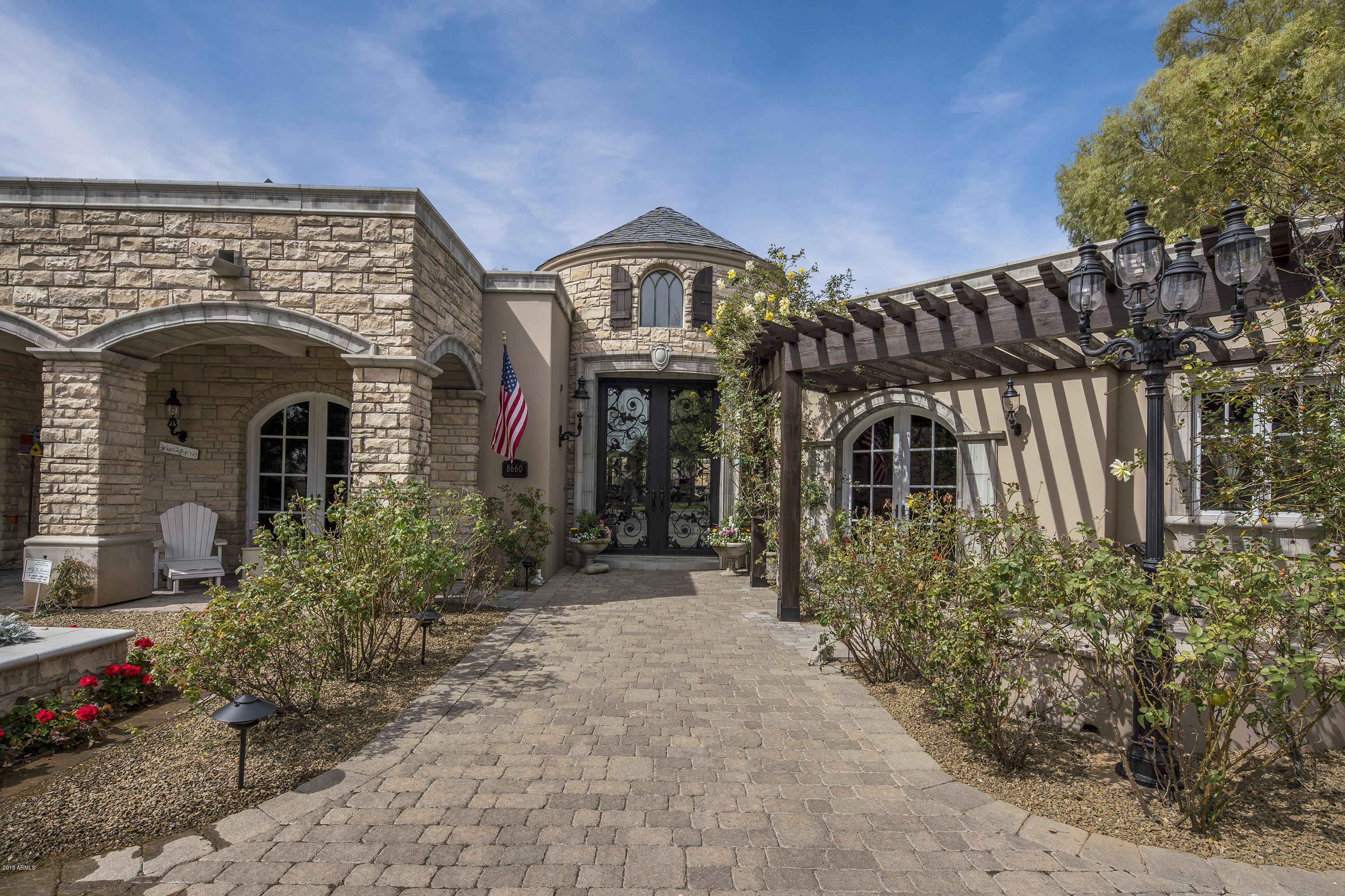 This French Country Estate will take your breath away the moment you walk through the front door. Reclaimed Pine wood floors, Old Chicago Brick fireplaces and custom mill work through the homes make this property both elegant and charming. Luxurious Master Suite is complete with a sitting area, his/her closet and a gorgeous bathroom with Carrara Marble counter tops. Secondary guest suites are generously sized with dutch doors and great walk-in closets. The home theater is fully equipped with black out shades, cozy recliners and a wet bar - making movie night an every night occurrence. The meticulously landscape backyard offers lush green grass, a tennis court, a resort pool with water slide and spa. You will not want to miss this extraordinary estate.