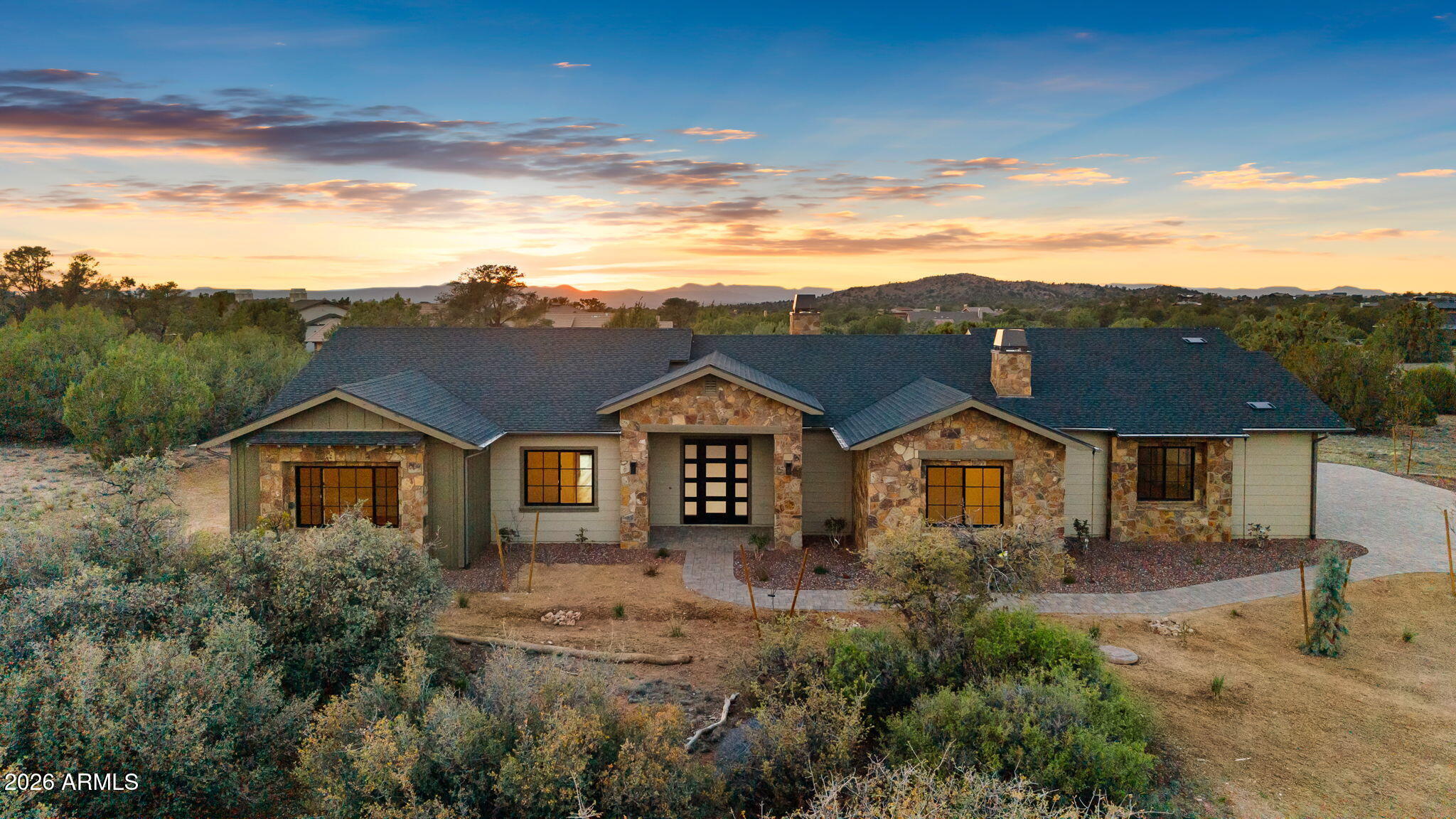 Brand new, move-in ready home on nearly a one-acre homesite, offering luxury, privacy, and thoughtful design throughout. Includes a Social Membership initiation fee to Talking Rock (at close of escrow). This versatile floor plan features 3 bedrooms plus a dedicated office, with the option to use the office as a 4th bedroom or flex space. All three bedrooms are true en-suites, complemented by an additional powder room for guests. Built by TDLC Construction, the home showcases exceptional craftsmanship with beamed ceilings, a striking stone fireplace, and custom built-ins. The chef's kitchen is designed for both function and style, featuring a 48' 8 burner Wolf gas range & hood, 48' KitchenAid refrigerator, wine fridge, large center island, quartz countertops, and a spacious walk-in pantry. Additional highlights include an oversized 3-car garage with epoxy floors and an expansive covered back patio complete with a built-in BBQ--perfect for indoor-outdoor living and entertaining. Talking Rock is a gated private community for members only with four seasons of golf, on-site dining options and wellness focused amenities & lifestyle.
