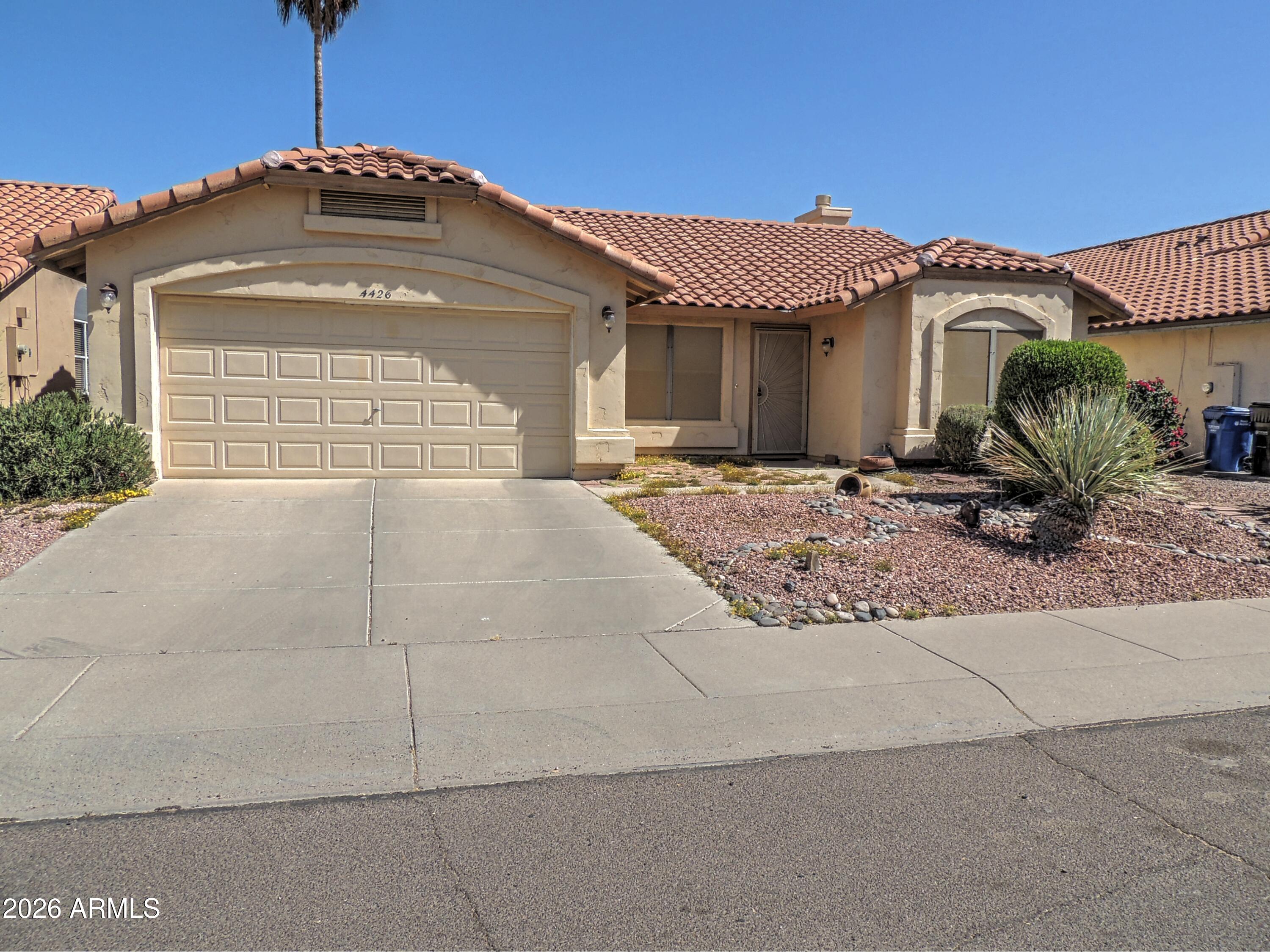 Discover this inviting Ahwatukee home offering comfort, privacy, and carefree living with no HOA. This well-designed residence boasts a popular split primary suite floor plan, with the spacious owner's retreat and bath separated from the secondary bedrooms. The kitchen impresses with tons of counter space and a pantry, perfect for meal prep and storage. A convenient separate laundry room adds everyday practicality. Step outside to relax on the large covered patio overlooking a lush backyard filled with mature landscaping. Towering trees and established greenery provide shade and privacy, creating a serene oasis perfect for year-round enjoyment. Enjoy easy access to South Mountain trails, excellent schools, shopping, and dining. This home combines established charm with practical luxury.