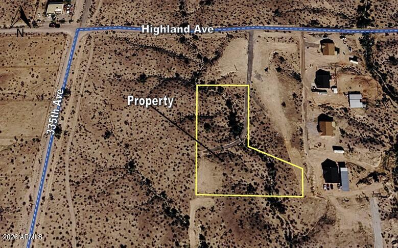 Beautiful panoramic view of the white tank mountains. Shared well with servicing four lots. Very few neighbors. Great location for a custom home. Located near I-10 and the masterplan community Belmont. Underground power on property line (Highland Ave). Property tax shown is for 5 acre parcel before minor land division. No HOA and plenty of room for Horses, Toys & RV parking.