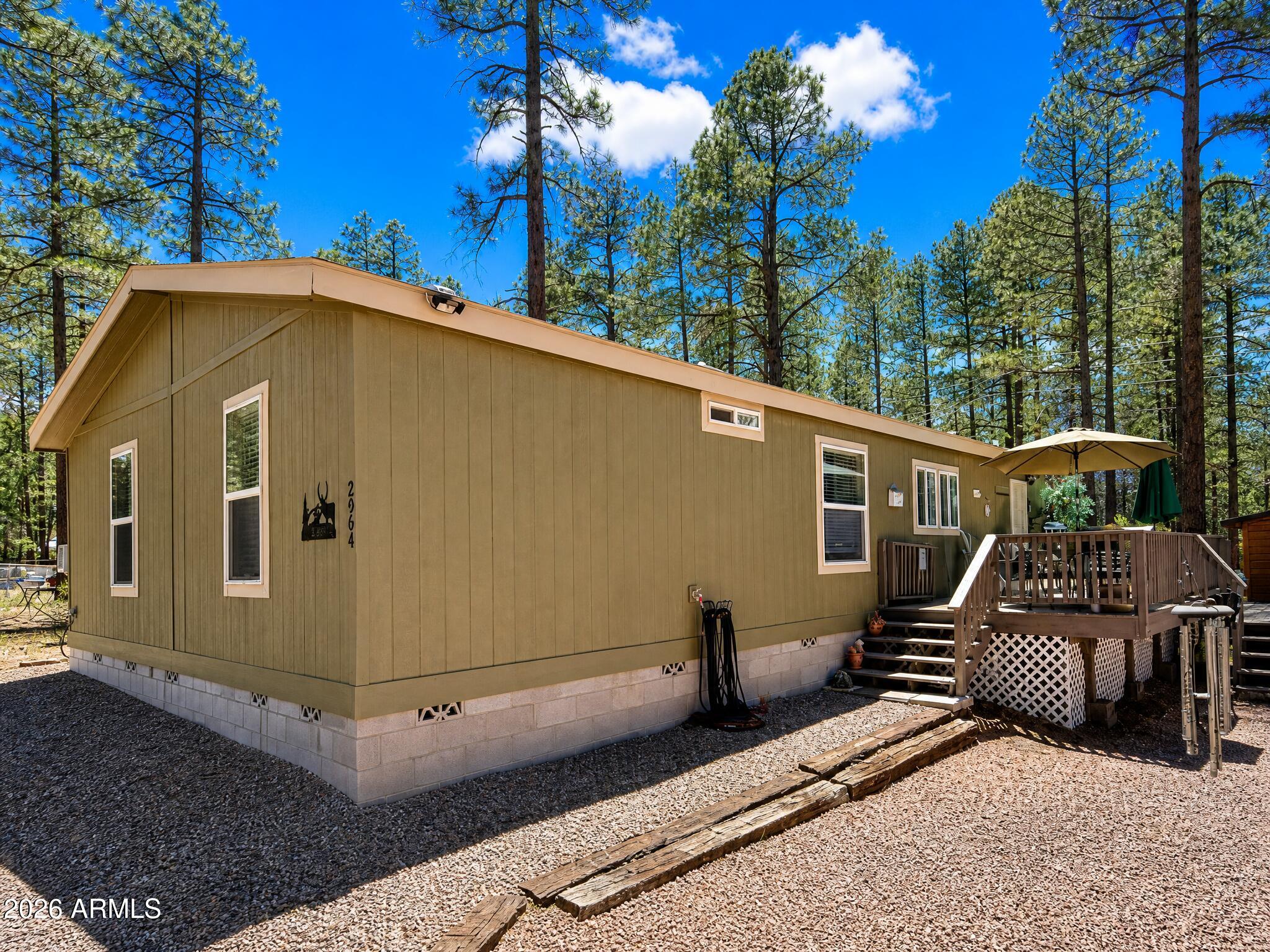Built 2022 • New 10x30 deck • Apache-Sitgreaves National Forest access, 3 bed, 2 bath, 1,600 sq ft open-concept home built in 2022 in Overgaard at approx 6,500 ft elevation. Primary suite features large walk-in shower. Interior opens directly to a new 10x30 deck with views of surrounding ponderosa pines. Level lot includes storage shed and garden shed. Modern finishes throughout. Located in Heber-Overgaard near Apache-Sitgreaves National Forest trail access and AZ-260 corridor. Approx 45 mi to Pinetop-Lakeside dining and services. Black Canyon Lake approx 18 mi.