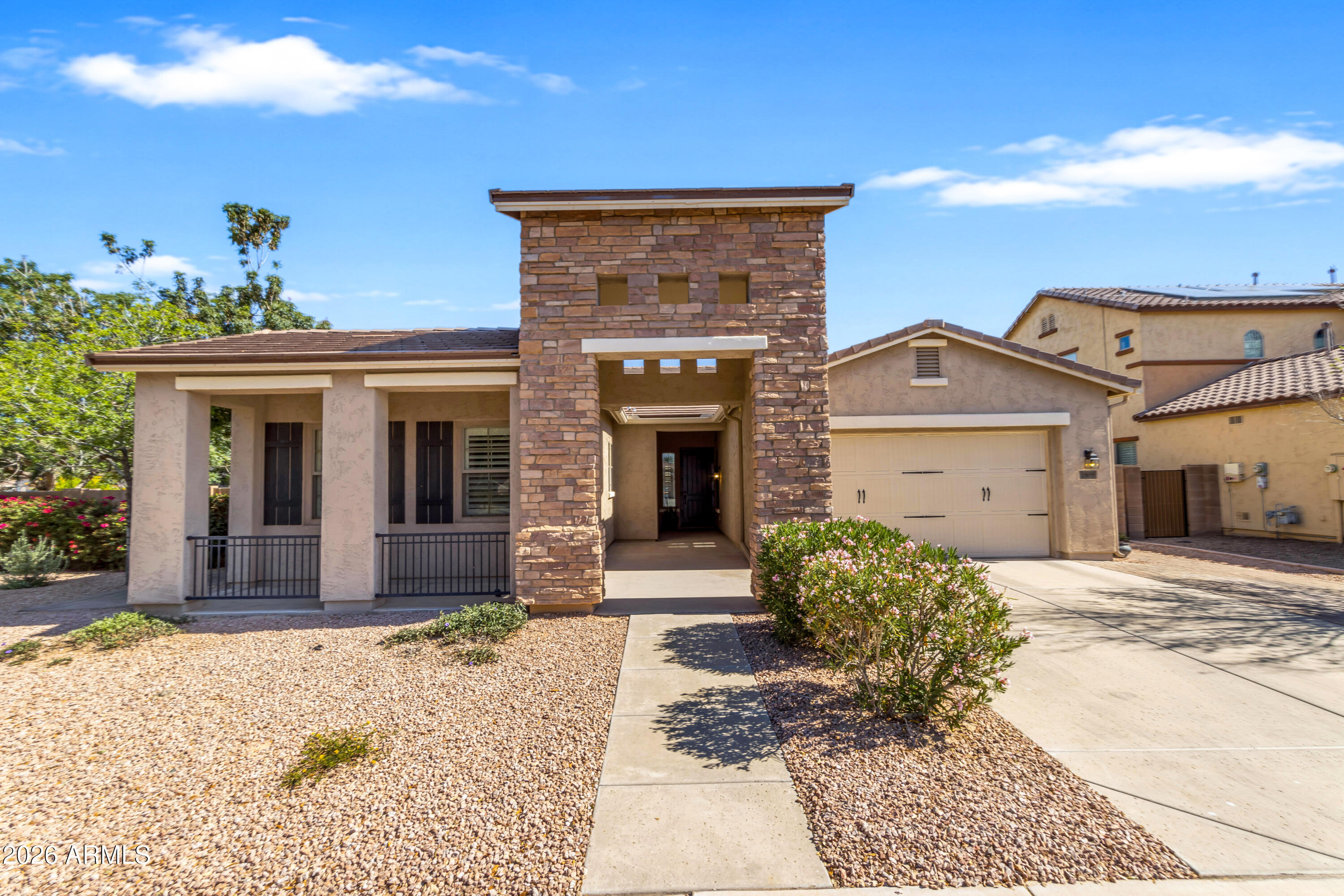 Tucked into the sought-after Sossaman Estates community, this single-level home corner lot immediately reflects pride of ownership. From the moment you walk in, the thoughtful layout and attention to detail stand out. Main living room opens to views of the backyard, while a separate family room off the kitchen offers a more relaxed space with access to the patio. The kitchen features an eat-in dining area, abundant cabinetry, and generous counter space designed for everyday living. Split floorplan provides privacy, tile flooring throughout most of the home, plantation shutters . Primary suite offers a well-appointed bathroom and a spacious walk-in closet. Out back, the setting invites you to slow down. A built-in pergola, fireplace, and expansive paver patio for entertaining. North facing backyard, tankless water heater, new roof underlayment in 2022.