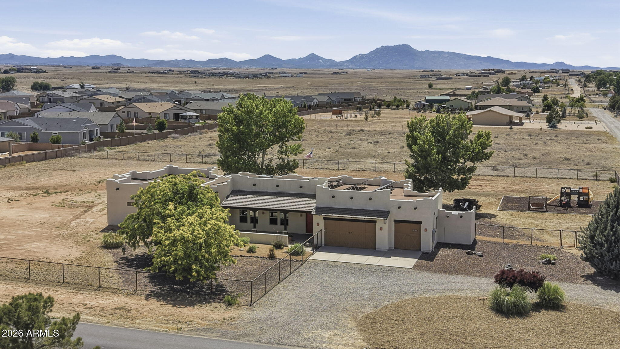 Enjoy country living with room to grow in this Santa Fe-style home in Antelope Meadows. Situated on 2 acres, this property offers 5 Bedrooms plus an Office, 3.5 baths, owned Solar, and flexible living space. The 2,114 sq. ft. main home features a striking beamed great room, rich hickory cabinetry and doors, and warm Southwestern charm throughout. A newly completed 1,113 sq. ft. Addition with two private exterior entrances provides endless possibilities for multigenerational living, guests, a home business, or hobby space. Additional highlights include a productive well, owned water softener, mostly fenced acreage with RV gate, covered front and rear porches, and a 3-car Garage with attached storage shed. Enjoy the space, privacy, and freedom of rural living.