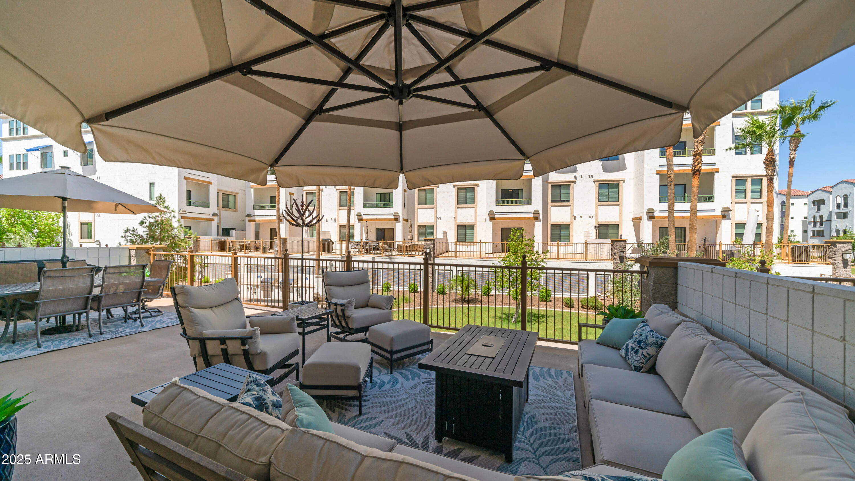 Incredible Opportunity For A Completely Low Maintenance Highly Upgraded Luxury Condo. This Is One Of The Newest Built In The Entire Community. 2024 With Hard Wood Flooring, Open Kitchen With Large Breakfast Bar With Wainscoting And Solid Quartz Counters, Upgraded 42'' Upper Cabinets, Tile Backsplash, Undercabinet Lighting, Black Stainless Appliances Including Refrigerator. Great Room And Both Bedrooms look Out To One Of The Largest Private Patios With Courtyard And Water Views. The Patio Creates A Complete Outdoor Oasis For Entertaining, Barbequing And Enjoying The Extra Space. The Primary Bedroom Is Large And Features A Luxury Bath With Double Sinks, Huge Walk In Shower And Closet. High End Shutters For Privacy. The Amenities Are Over The Top. Huge Pool, Fitness Center, Club House And