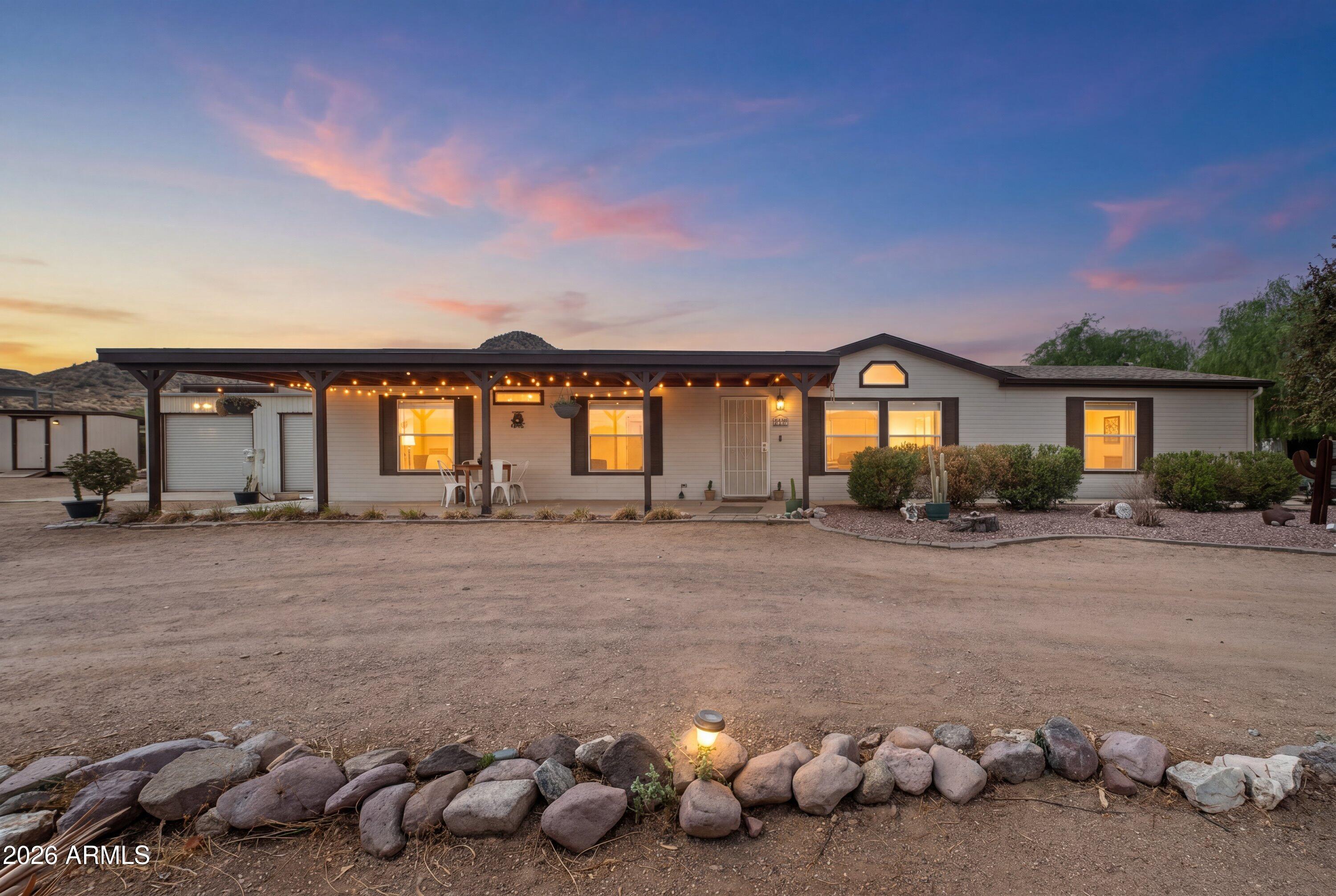 Horse lovers, this is the one you've been waiting for! Set on 1.25 acres with stunning Superstition Mountain views, this 3bed/2bath property is thoughtfully designed for both you and your horses.

It includes 10 stalls, a round pen, and a small riding arena or turnout, giving you everything you need to ride, train, and care for your horses at home. Saddle up and ride right off the property to miles of beautiful desert trails--no hauling required! After your ride, enjoy grabbing a bite at several popular local eateries just around the corner.

Less than 5 minutes from US-60, you'll have quick access to the Valley while enjoying the peaceful country lifestyle. Spend your weekends boating, kayaking, or fishing at Canyon Lake just 20 minutes away, or cool off at the Salt River!