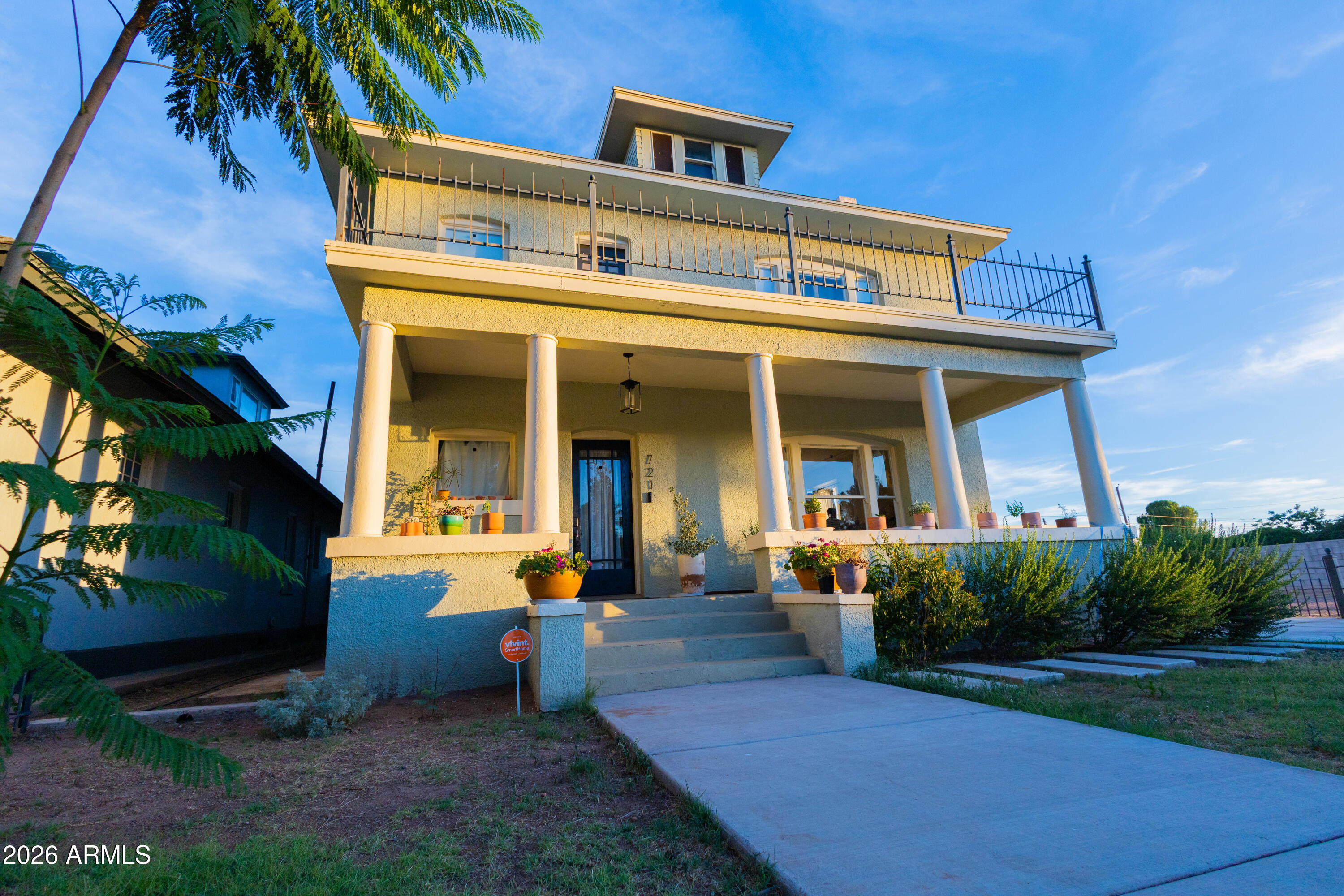 HISTORIC CHARM AND MODERN LUXURY! Front-row seat to Douglas's beloved Castro park. Built in 1905 and thoughtfully renovated, this spacious 4-bedroom, 2.5-bath home offers over 2,800 square feet of natural light-filled living space directly across from Castro Park, where community events, food trucks, green space, and views are just steps from the front porch.

Inside, the home blends character with the updates buyers want today -- high ceilings, large original windows, beautiful natural light, wood and tile flooring, and a tiled fireplace bring warmth and character to the main living spaces. The recently renovated kitchen features quartz countertops, a gas range, center island, custom cabinetry, and a new tile backsplash. The main level also includes a 5th room! The main level also includes a flexible fifth room that can serve as a library, media room, art studio, library, den, office, or additional gathering space.

Upstairs, all four bedrooms are privately situated on the second floor, including a spacious primary bedroom with park views and a walk-in closet designed with two separate sides. The bathrooms have been updated with modern fixtures, including a double vanity and a soaking tub in the second full bath. A second-floor balcony provides beautiful views over Castro Park, while the front porch, shaded back porch, and private fenced backyard extend the living space outdoors.

The home has also seen meaningful system and cosmetic updates, including updated plumbing, updated electrical, central AC throughout, new flush-mounted lighting and fixtures, fresh interior paint, renovated kitchen and baths, and front and back yard beautification to include drip irrigation. The backyard includes green turf and a child playhouse, and the gated driveway has a gated two-car garage.

Located in a beautiful historic neighborhood surrounded by other early 1900s homes, this property is also within walking distance of downtown Douglas, the local library, post office, local restaurants, and the world famous Gadsden Hotel. With its generous size, modern updates, park-front setting, gated parking, and unfinished attic offering future expansion potential, this is a rare opportunity to own one of Douglas's exceptional historic homes!