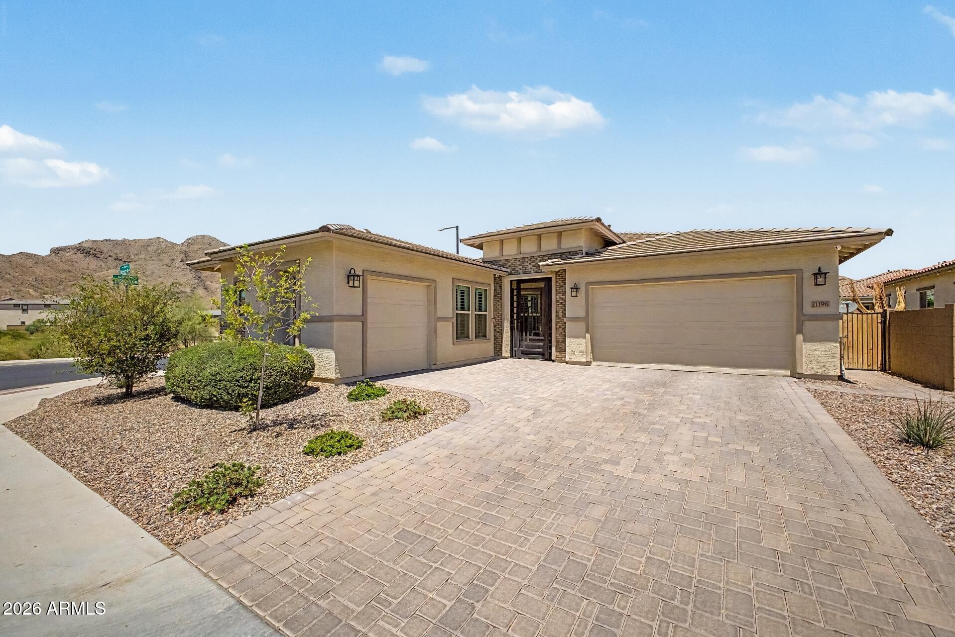 Discover desert living at its finest in Buckeye with this beautifully designed home featuring a highly desirable attached casita--perfect for guests, multigenerational living, a private office, or rental potential. The spacious floorplan offers comfort and flexibility, while the true 3-car garage provides ample room for vehicles, storage, and toys. Enjoy stunning mountain views and Arizona sunsets from your backyard oasis. Conveniently located near golf, shopping, dining, and freeway access, this home combines privacy, versatility, and scenic beauty in one exceptional package. Nestled in the master plan community of Sienna hills offering a community pool, fitness center, elementary school and miles of hiking paths!