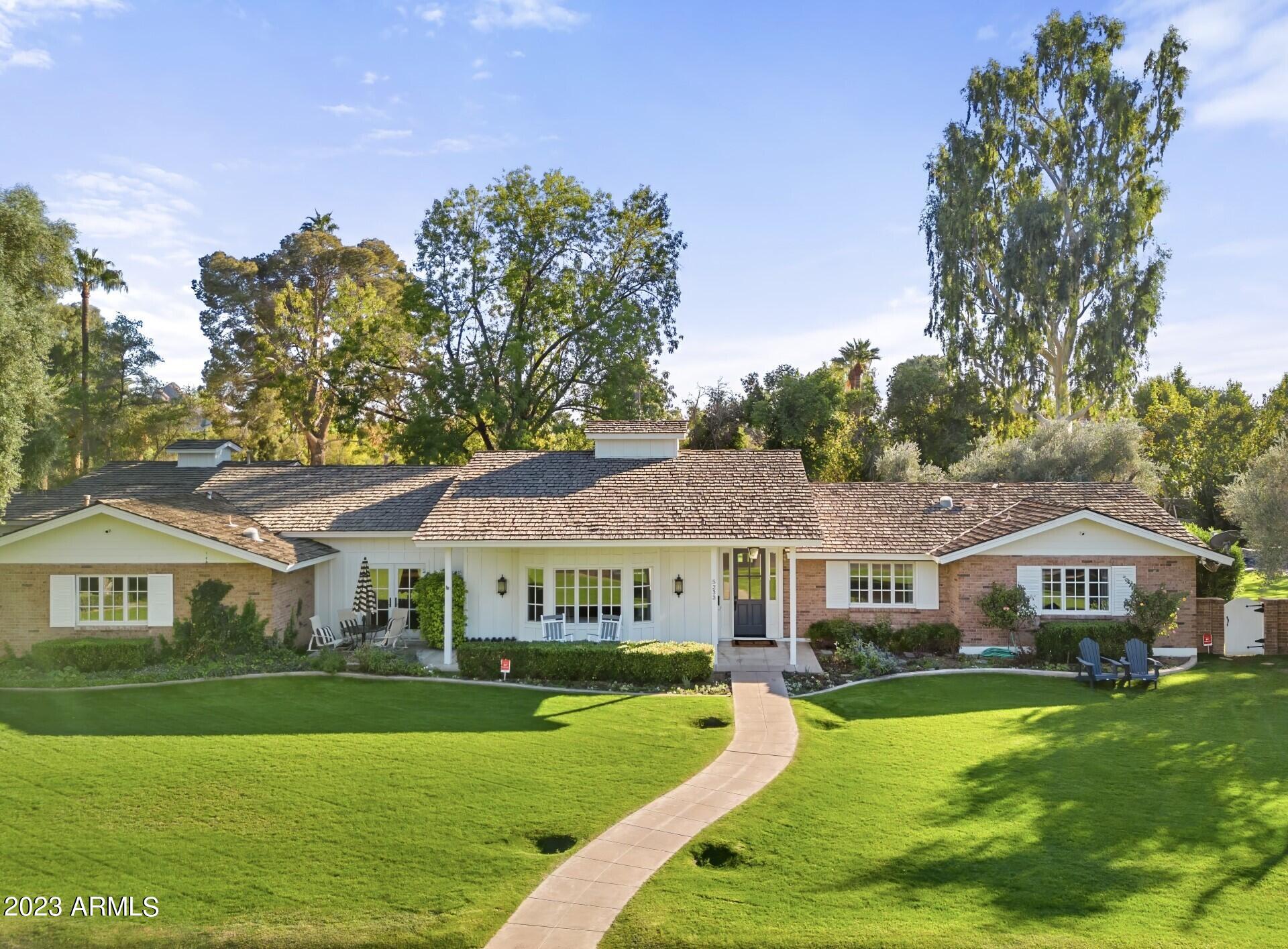 Quintessential Arcadia Living on a large 28,000+ sq ft. lot. This home is an absolute remodeled jewel, with raised 10 ft ceilings, and a beautiful, custom trim package throughout. The floorplan is split and offers a sizable bonus room for various activities. There is a wonderful laundry/ craft room that is not to be missed. The flooring has extensive use of Herringbone brick, wood and marble. The open kitchen is quite charming, with its marble topped island and counters, looking out upon a picturesque backyard. Wrapping the house are inviting patios for friends and family to gather, all accessible through different sets of French doors. The backyard landscaping is lush and mature and features a marvelous private pool. There is a very spacious area for games, and gardens. An ideal location near great schools, downtown Scottsdale, Phoenix and more.