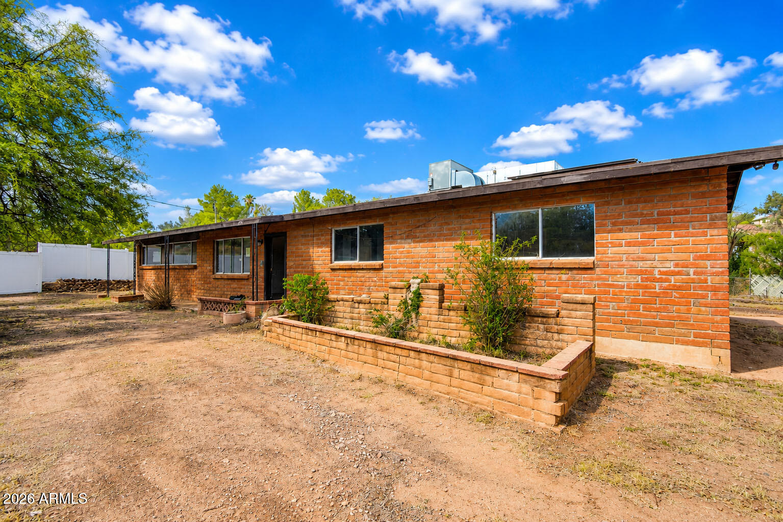 Welcome to this charming 3-bed, 2-bath home situated in the desirable Royal Road Terraces neighborhood. Built in 1964, this property has been previously updated to the kitchen, bathroom fixtures, and systems. The home features solar panels for energy efficiency and long-term utility savings. A spacious family room provides ample gathering space, while a versatile bonus area offers flexibility for home office, recreation, or creative projects. The expansive lot provides privacy, room to breathe, and potential for future enhancements. Located minutes from State Route 82 for convenient regional access, and just a short drive to vibrant Downtown Nogales with its shops, dining, and community services. This property combines accessible location with country-feel living. An excellent opportunity for buyers seeking value, established infrastructure, and room to make this home their own.