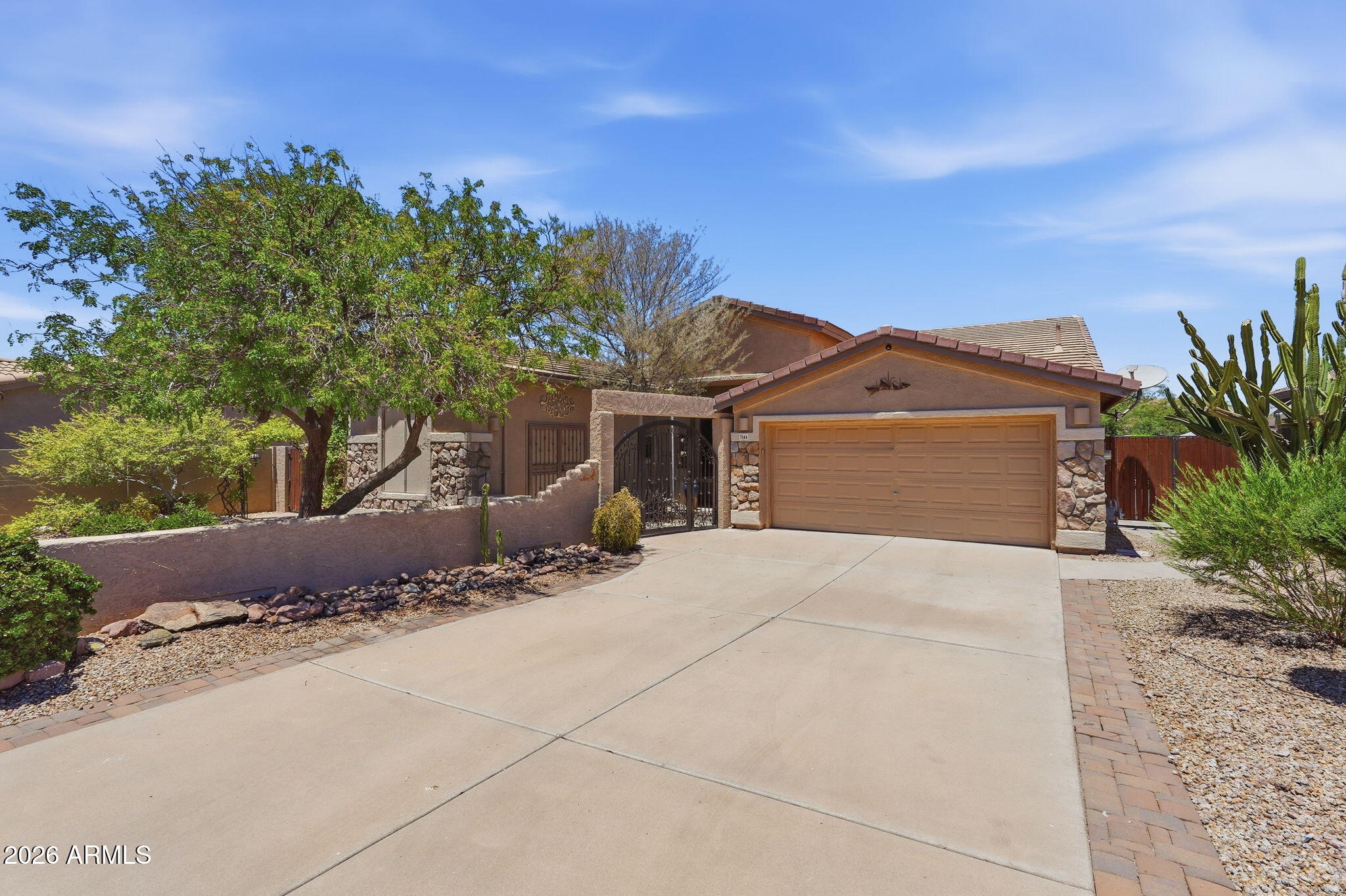 NEWER ROOF! Fresh interior paint & new carpet. 2 new HVAC units in 2024. This fantastic single level home in Gold Canyon / Superstition Foothills is ready for you to call it YOUR HOME! The courtyard with beautiful iron gate and stunning mountain and sunset views will be your favorite place to relax. This home has a spacious open floor plan with 3 large bedrooms/2.5 bathrooms, den and huge casita/studio.  The large family room and dining area are fabulous for entertaining. The hall bathroom has been beautifully updated with double sinks and walk-in shower. The kitchen has beautiful cabinets and quartz counters with a light and bright breakfast room with a coffee bar, wine fridge and extra storage. Enjoy the views of the pool and beautiful back yard. Enjoy the views of the pool and beautiful back yard. Large Owners' suite with door to the back patio and pool.  Enjoy the putting green, ruby red grapefruit, orange and lemon trees in the lush back yard...