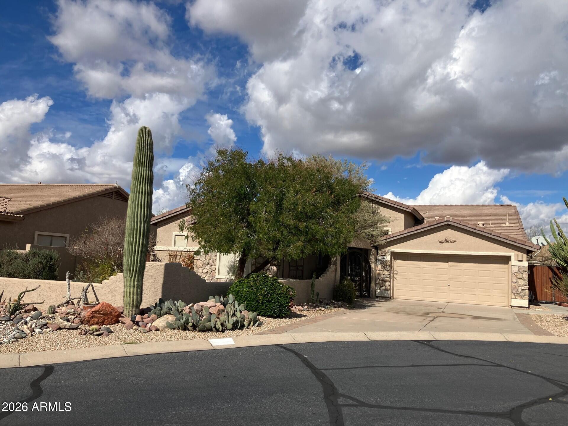 NEWER ROOF! Fresh interior paint & new carpet. 2 new HVAC units in 2024. This fantastic single level home in Gold Canyon / Superstition Foothills is ready for you to call it YOUR HOME! The courtyard with beautiful iron gate and stunning mountain and sunset views will be your favorite place to relax. This home has a spacious open floor plan with 3 large bedrooms/2.5 bathrooms, den and huge casita/studio.  The large family room and dining area are fabulous for entertaining. The hall bathroom has been beautifully updated with double sinks and walk-in shower. The kitchen has beautiful cabinets and quartz counters with a light and bright breakfast room with a coffee bar, wine fridge and extra storage. Enjoy the views of the pool and beautiful back yard. Enjoy the views of the pool and beautiful back yard. Large Owners' suite with door to the back patio and pool.  Enjoy the putting green, ruby red grapefruit, orange and lemon trees in the lush back yard...