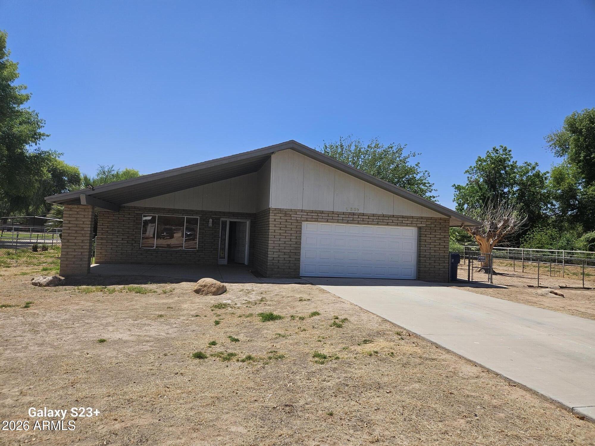 Beautiful property featuring fenced pastures, horse corrals--perfect for equestrian living. The home offers a comfortable layout, cabinetry, ample storage, three bedrooms plus a den, NO HOA.

The family room showcases a wood accent wall and a cozy fireplace, creating a warm and inviting space. as well as nice tile floor in the main areas, and the den/office provides a generous, versatile area with designer touches & elegant laminate wood flooring