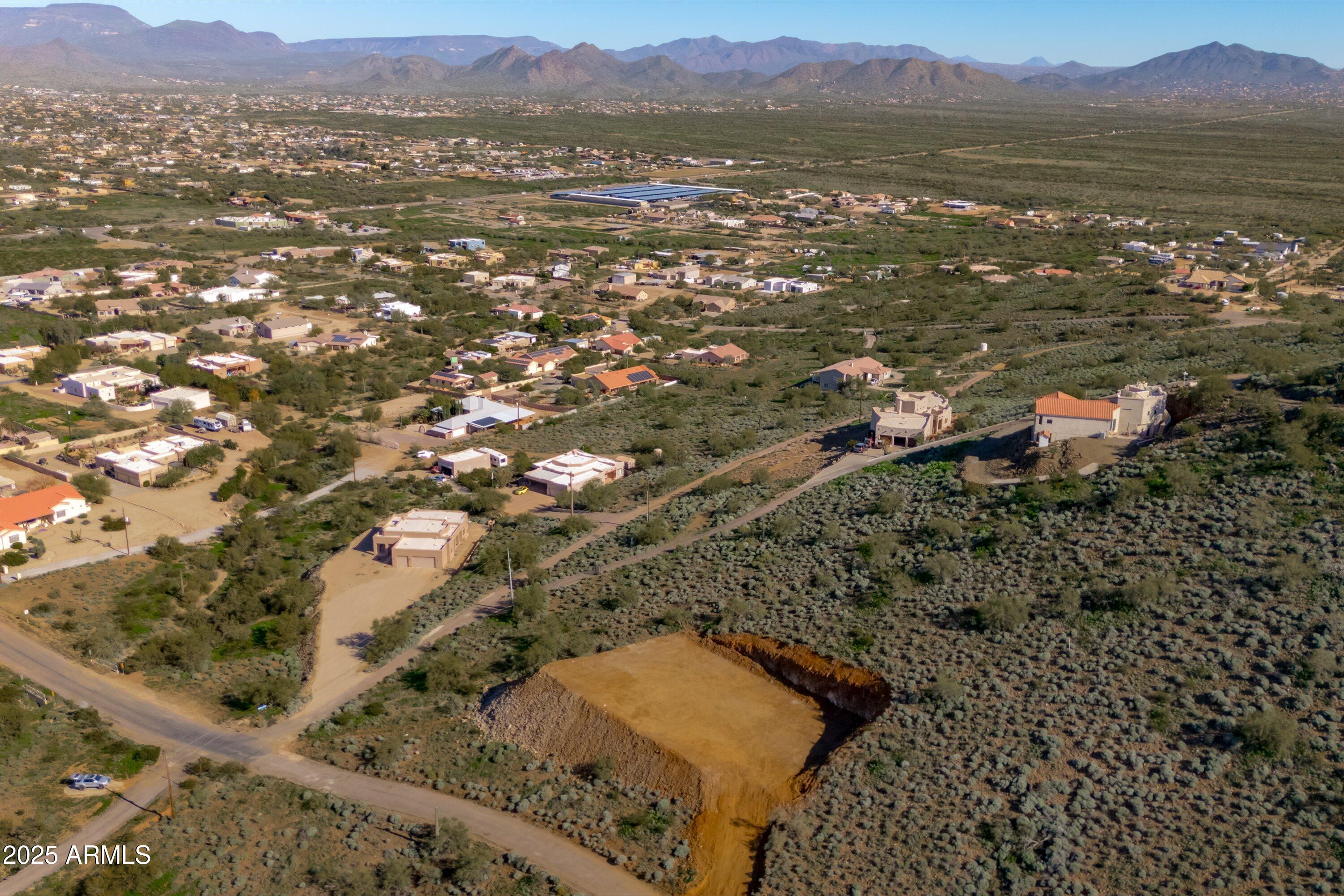 Price Improvement--Motivated Seller! Elevated 1-acre hillside lot with a building pad already installed, ready for your custom home. Take in sweeping Desert Hills views for miles while securing a prime homesite in one of North Phoenix's fastest-growing areas. Just minutes from the TSMC chip plant, where ongoing expansion continues to drive demand. Paved road access, close to Cave Creek shopping, dining, and easy I-17 access. Opportunities like this are getting harder to find--now is the time to act.
