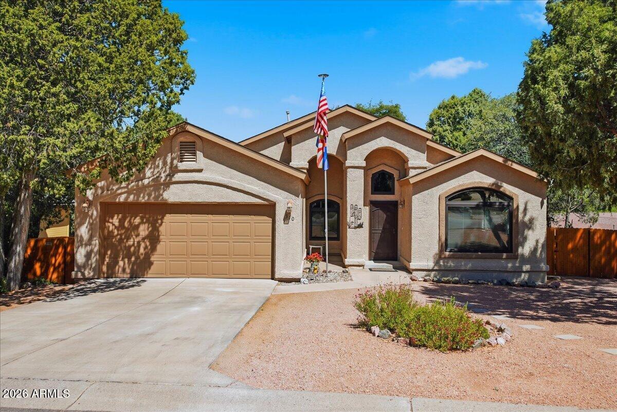 Located in the highly desirable Trailwood neighborhood, one of Payson's most sought-after walkable communities, this beautifully updated 3-bedroom, 2-bath home offers comfort, quality, and convenience. The spacious open floor plan features vaulted ceilings and abundant natural light. Major updates include the AC, roof, water heater, and custom cedar fence, all less than 5 years old. Enjoy mountain views from the expansive back deck, with stairs leading to a peaceful Ponderosa pine-covered backyard. Just minutes from shopping, dining, medical facilities, Rumsey Park, and the Payson Public Library, this move-in-ready home