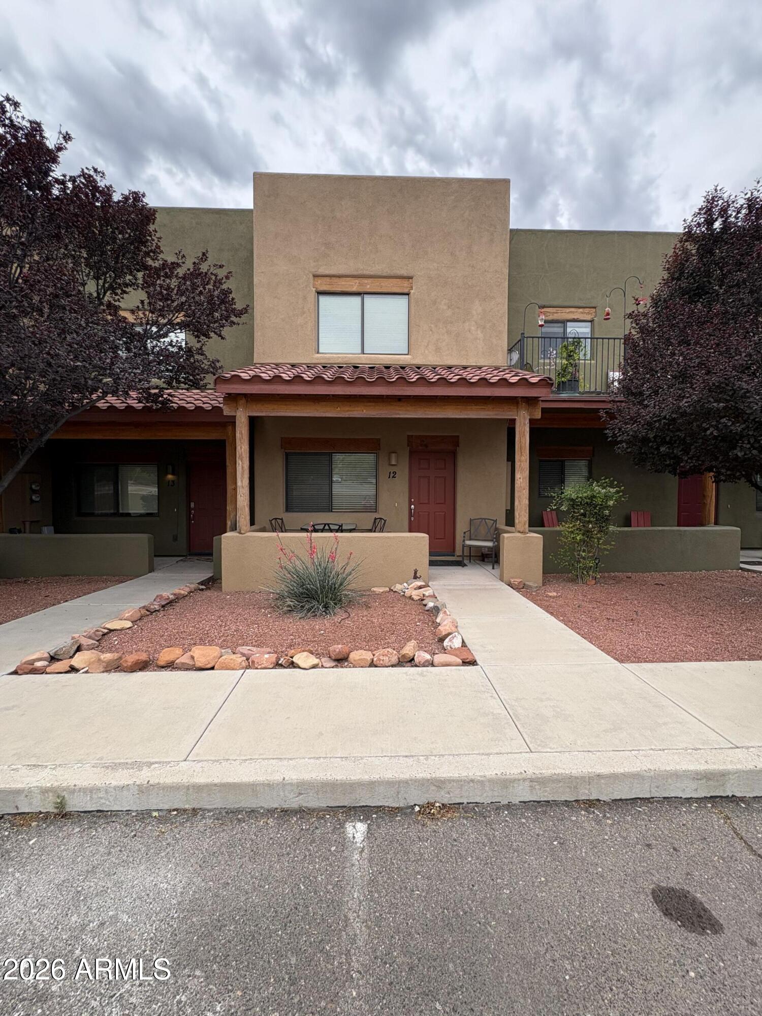 Welcome to this lovely 2-plus-bedroom condo in the neighborhood of Rimrock, Arizona, just minutes from Sedona. The home is located in a dark sky community with beautiful night skies and within walking distance of the National Forest, hiking trails, and Prostine Creek. It is a short distance from the iconic red rocks of Sedona, but without the tourists and traffic. The home boasts granite countertops, stainless steel appliances, and wood cabinetry. It has a covered front patio and a balcony off one of the bedrooms, and has been renovated/redesigned to add plenty of space and/or a small kitchenette in addition to the main kitchen. Redesigned for a possible 3rd bedroom, office, or second living room. We invite you to come see.