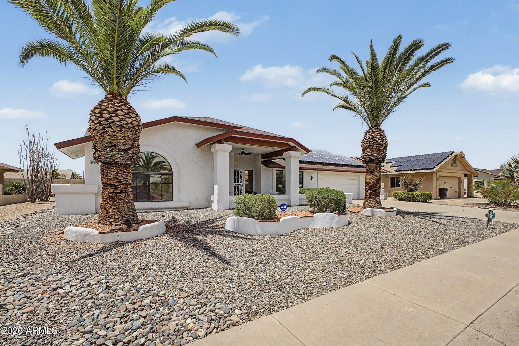 Lovely home located in the wonderful community of Sun City West. This 2 bedroom,2 bathroom property features cathedral ceilings, wood and tile flooring and granite countertops. Relax in your versatile bonus room perfect for a movie room or den. Additional room off of the kitchen is equipped with lots of storage, ideal for an office, sewing, or craft room.Spacious primary bedroom offers a walk-in closet and a private en-suite bathroom. Second bedroom features an exquisite built-in Murphy bed system to easily transform the room to fit your desires. Hobbyist's garage equipped with built-in cabinets, workbench and an Aurus mini split system ensuring a comfortable environment for year round projects. Enjoy the low utility bills with the energy saving solar system. New roof with warranty to be installed!