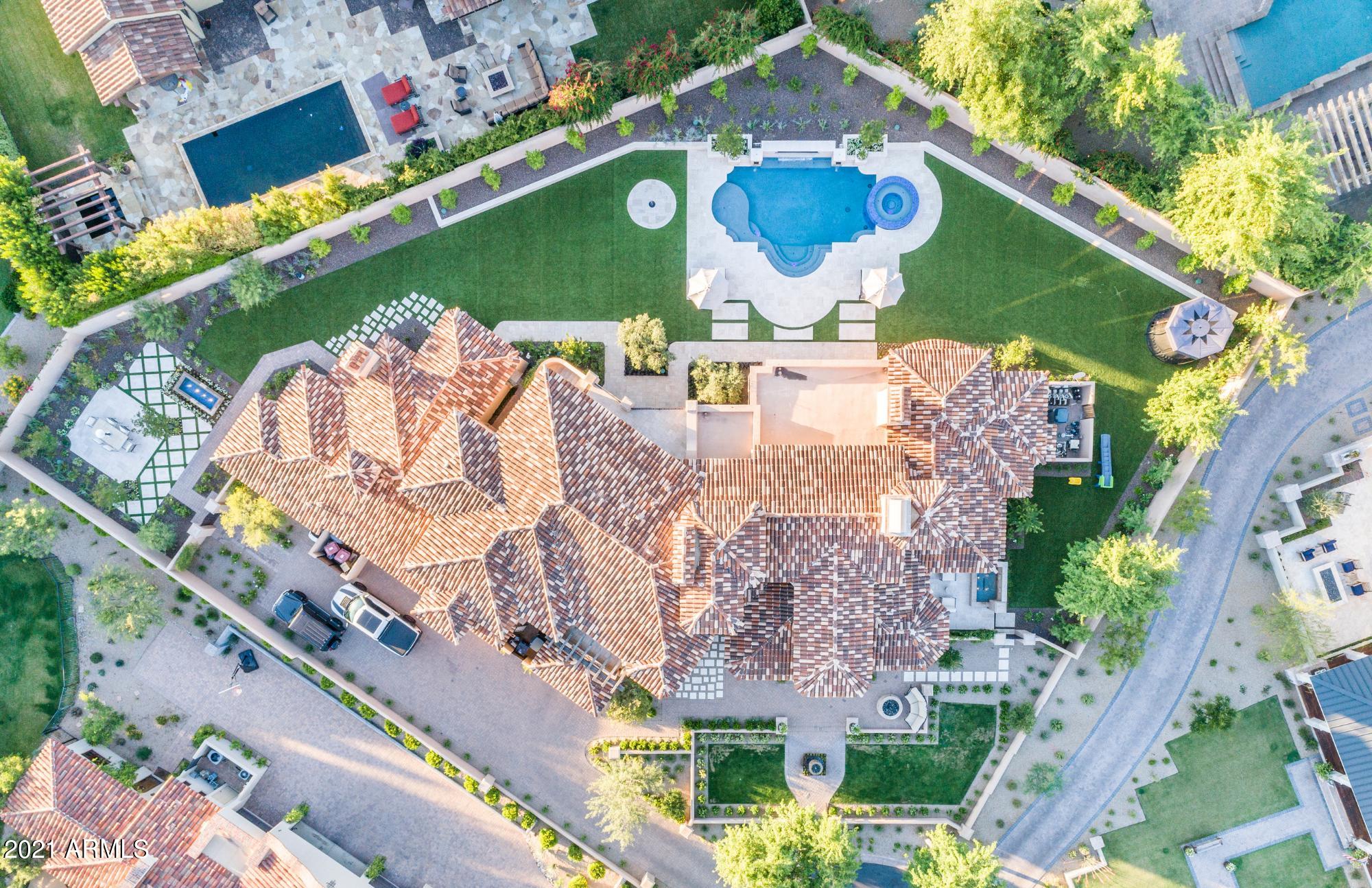 The Arcadia neighborhood in Silverleaf is one of the most sought after locations in the Valley and this home is certainly one not to be missed. Candeleria Design & Fratantoni Luxury Estates thoughtfully crafted this 6,559+ square foot, 6 bedroom + office and 5 bath Spanish Mediterranean stunner, with timeless high quality finishes and design. The great room floor plan seamlessly opens to the private and resort style backyard with mountain views, providing the desired indoor/outdoor lifestyle perfect for family living and entertaining. The separate guest house has a full kitchen along with living room, full bathroom, and 2 bedrooms. This home provides resort style living in every aspect.