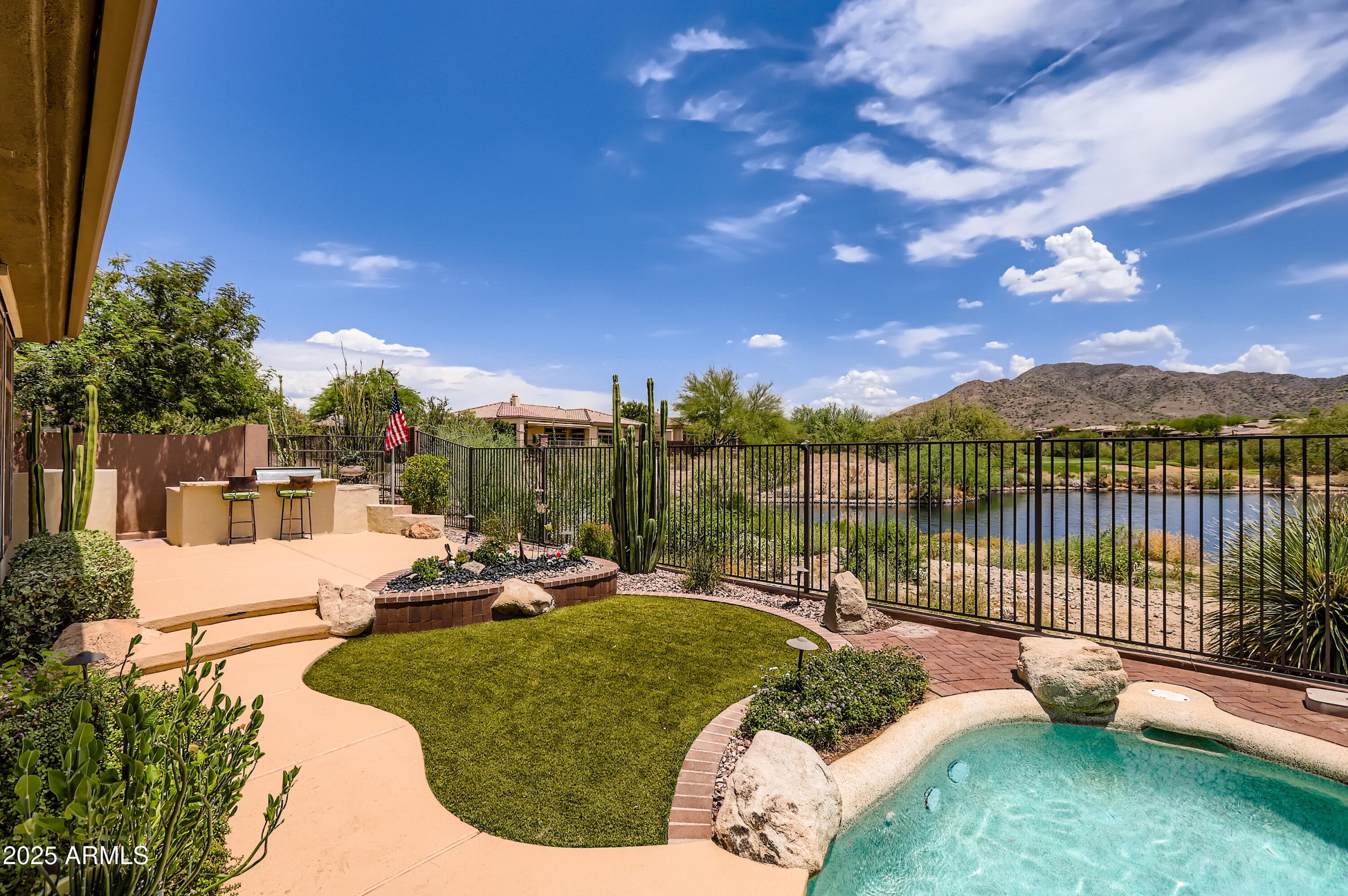 After 25 years of LOVING this ever-changing view lot, it is time to let the right family enjoy it now.  In prestigious Anthem Country Club the home offers unmatched views that are among the best in this community. Your eyes will enloy a pool, a lush greenbelt, a serene pond, a golf course, & Daisy Mountain. The home was chosen to maximize stunning vistas, expansive windows line the back, showcasing breathtaking scenery from the office, family room, living room, & kitchen. Incomparable! The home features solar power, water treatment, a heated pool, an open floor plan, & a 3-car garage. If you plan to get a new golf membership in Anthem, please let us know when offering for some savings on the membership. Anthem features 2 great golf courses, 2 of much more, simply 2 much fun!