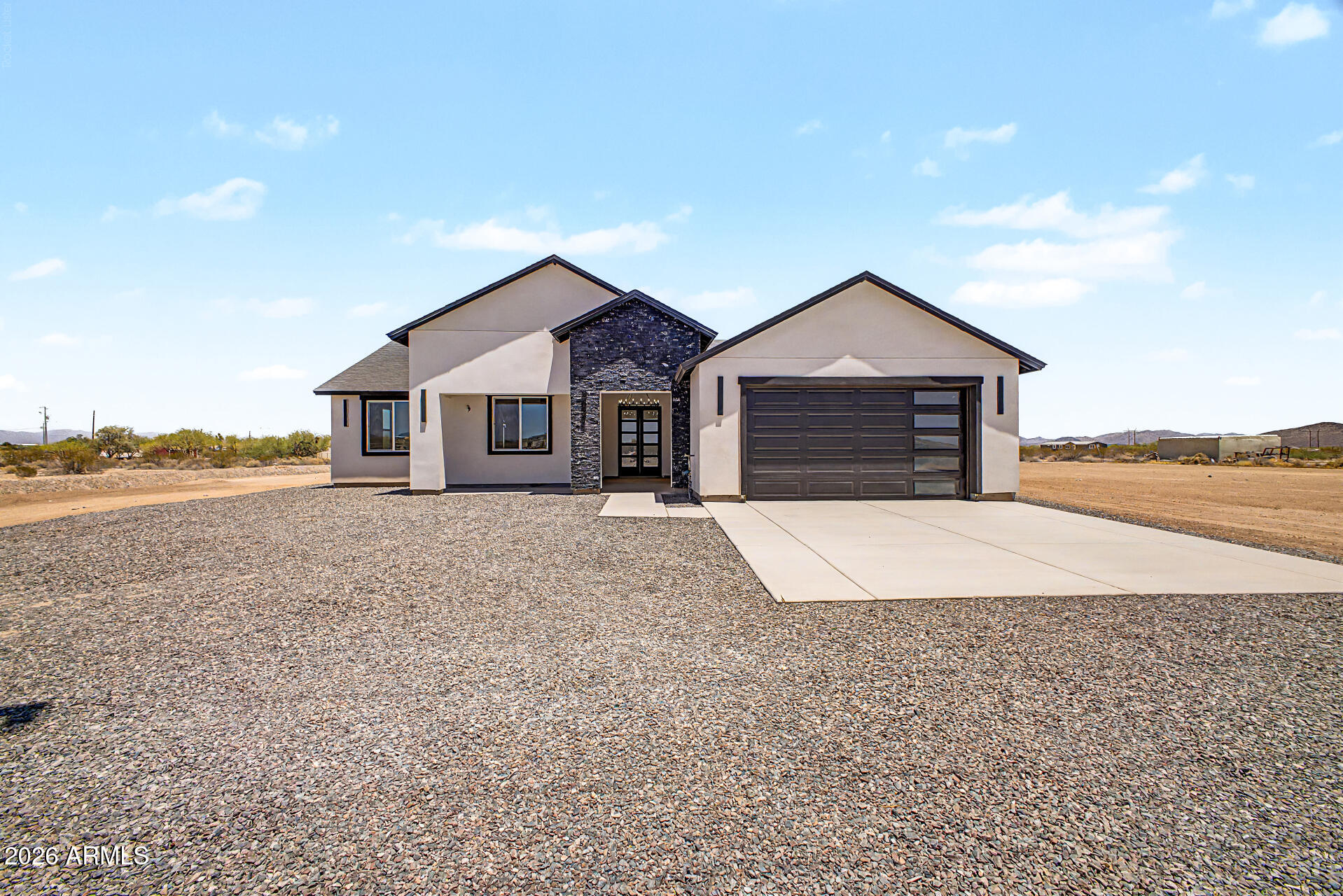 Brand-new construction on over an acre with beautiful mountain views! This 4-bedroom, 2-bath home offers 1,892 sq. ft. of thoughtfully designed living space with a 2-car garage on a 1.04-acre lot. Enjoy the freedom of no HOA and plenty of room for horses, animals, RVs, toys, or future additions. The open floor plan features abundant natural light, laminate flooring throughout, a spacious kitchen with a large granite island, two-tone cabinetry, and granite countertops. The primary suite includes dual sinks and a luxurious tiled walk-in shower. Laundry room with sink and cabinets. USDA financing eligible. Move-in ready!