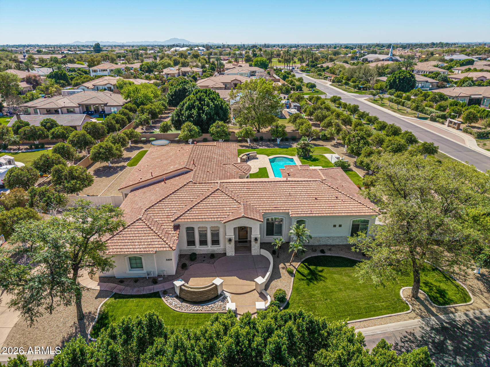 Fully remodeled 6,401 SF luxury basement home with casita in the heart of Arboleda!

6 beds, 4.5 baths, 4-car garage. Set on ¾-acre corner lot next to central park with pickleball, tennis & more, far from busy streets, close to 202, Scottsdale, Tempe, PHX.

Gourmet kitchen with Sub-Zero fridge, Wolf cooktop, double ovens, sinks, dishwashers. 

Main office/library with custom workstations. Large primary suite with exercise room/second office/second laundry, huge closet.  

Interior casita has own kitchen, family room, second primary suite, exterior entrance. 

Timeless finishes throughout: wide hardwood floors, new cabinets, counters, bathrooms, doors, fixtures, fans, crown, base, trim. Resurfaced backyard pool, spa, travertine, RV gate, grass, citrus. Largest original single-level floor plan with basement in Arboleda with all extensions--5,084 square feet on main level with 4 bedrooms plus 1,317 square feet in basement with additional family/movie room, 2 more bedrooms, newly added storage.

Meticulous remodel completed for long-term living with no expense spared. Examples: all old arches removed in favor of clean lines, redesigned custom office, second laundry added, new closets created (in primary bedrooms and basement), 14,000 lbs of new decorative rock added to yard, new travertine patios, custom cabinets and hood to maximize storage and walkways to the inch, high-end finishes including new (not repainted) cabinetry, extra-wide flooring, all new doors, crown, tall base, molding, fixtures, shutters, etc. High quality repaint inside and out.  

Reverse osmosis units in main kitchen and butler pantry sinks and connected to pantry fridge.  Water softener and continuous hot water loop system installed. No wall hangings since completion of remodel. No smoking or pets in home during current ownership (6+ years). 

Gourmet kitchen is equipped w/everything needed for chef cooking, cabinetry to near ceiling, new counters, walk-in pantry, tile backsplash, stainless steel appliances, drop-in microwave, prep island, breakfast nook, and a peninsula w/a breakfast bar, lots of seating. 

Long bowling-alley-style hallways lead to enormous primary suite with lovely bay window, direct outdoor access, 2nd fireplace, a new ensuite w/dual vanities and tub, two shower heads and bench, and huge walk-in closet with its own walk-in linen closet. Located in a lush, social community with great amenities.