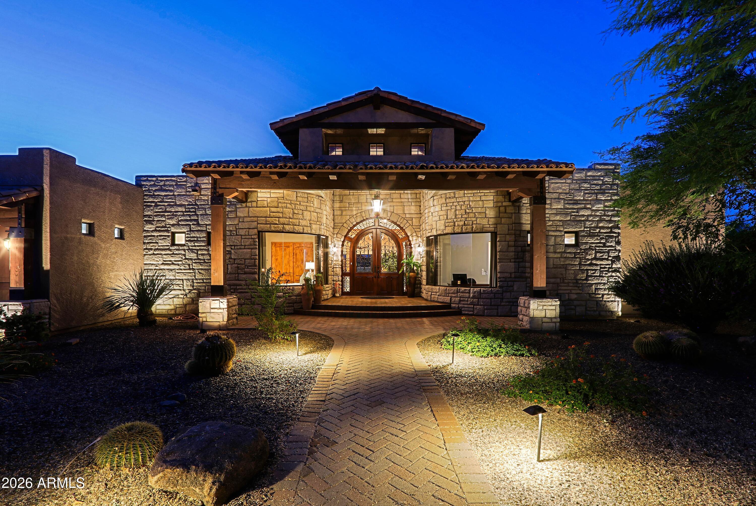 Experience North Scottsdale living at it's finest. This gorgeous 4240 SF home sits on a nearly acre cul-de-sac lot with a wash to the rear. North /South orientation. Impeccably maintained and boasts the desired features for luxury living. 4bd and 4.5 bath with great privacy in each. Separate living, dining, and family room off the beautiful kitchen. These areas are joined with a bar and butlers pantry. Nano bi-folding doors open the room to the beautiful expansive patio, pool, spa and stunning views. Great indoor/outdoor living! View deck allows for even more amazing views. Master Suite is well appointed with a fireplace, sitting area and and sprawling master bath. Each BD has custom blackout shades and ensuite bath. 4 cars can easily fit in the garage. Spacious laundry room. W/D included