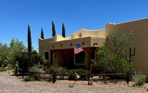 You will LOVE this CUSTOM home located on a corner lot with amazing mountain views! Remodeled Master Bathroom with HUGE walk-in/roll-in shower and a one-on-a-kind His n' Hers closet/dressing room! The kitchen is a chef's delight with a walk-in pantry, breakfast bar and formal dining room. Enjoy entertaining on the back covered patio or relax in the desert garden area. There are 2 RV gates and an RV hook-up for visitors plus an RV carport. The 3 car garage can be a great ''Man Cave'' with plenty of extra storage room. Two more carports on over an acre of land, an additional storage room and solar complete this great property! Call today for a private tour!