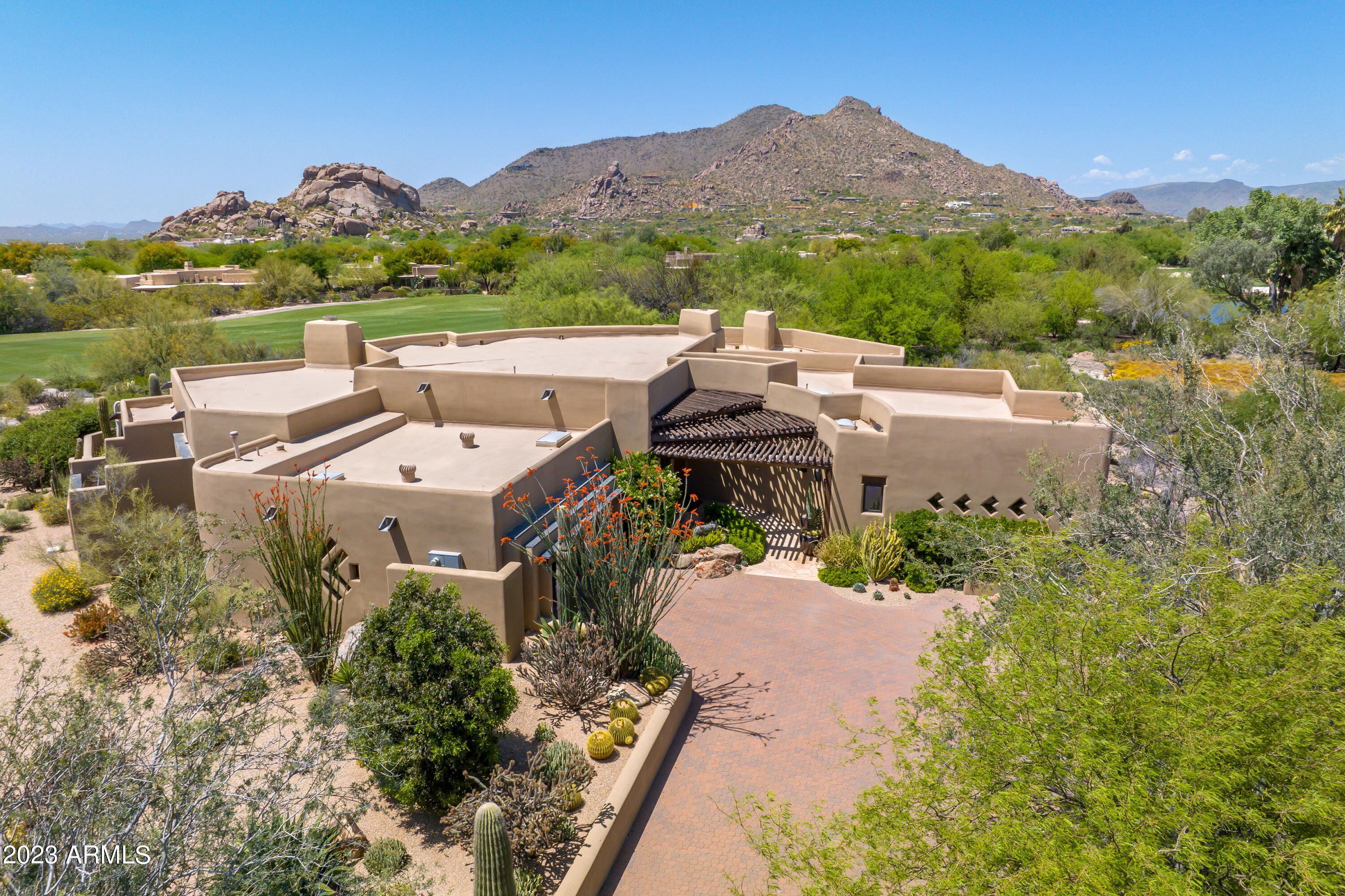 One of the finest lots within The Boulders and on the 18th Fairway, this rare and highly desirable  property offers elegant and timeless Southwestern architecture with a modern SmartHome interior. Views galore of the golf course, sunsets, and surrounding mountains. A split floor plan with ensuite guest bedrooms, an office or workout room, chef's gourmet kitchen with granite countertops and top-of-the-line appliances, and no interior steps make this rare and unique home perfect for the discerning buyer who appreciates luxury features with exceptional attention to detail. With a professionally designed interior, this home is offered fully furnished and move-in ready...only toothbrushes required. By appointment only-POF required prior to scheduling. Items included in sale are interior furniture, player piano, exercise bike, area rugs, wall mounted and free-standing artwork, all audio/video equipment, bedding, towels, dishes & utensils, glasses & stemware, small appliances, patio furniture, and golf cart. Listing agent's personal staging pieces are excluded.