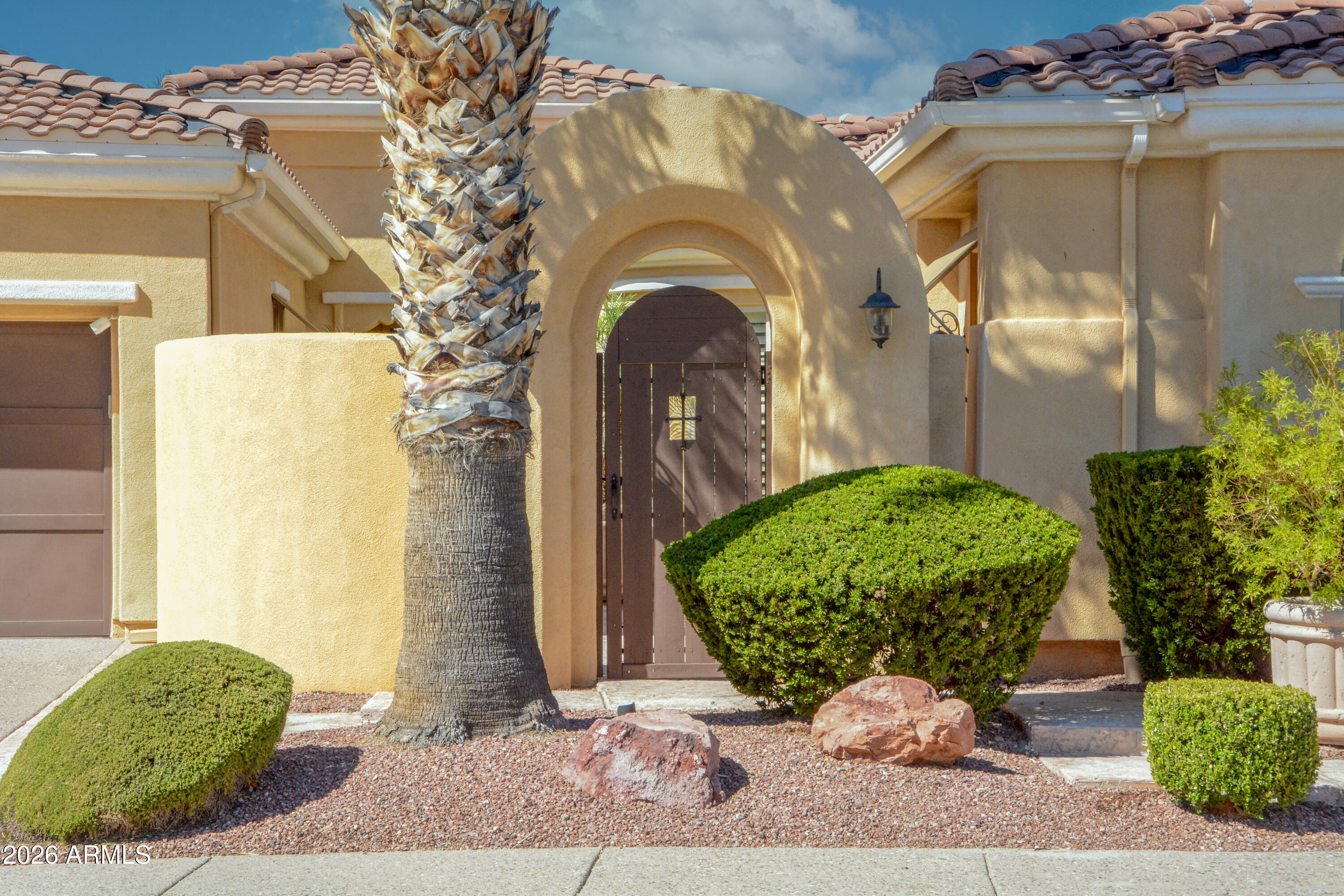 Experience resort style living in beautiful Corte Bella Country Club.  This gorgeous ''Alameda'' floor plan offers 2973 sq ft with guest casita making this a truly special home in every way. Enter a private courtyard w/ a fountain and enter through a custom glass entry door to discover, crown moldings, plantation shutters, Italian stone flooring, & 7'' baseboards. Enjoy a den with hardwood floors & french doors . The kitchen boasts Mastercraft cherry cabinets, stainless appliances, granite countertops and backsplash, with under cabinet lighting. Home has an extended garage with ample storage. Relax in the family room with a built in entertainment center, fireplace and surround sound with speakers. Escape to a private backyard professionally landscaped, with water feature and built in BBQ.