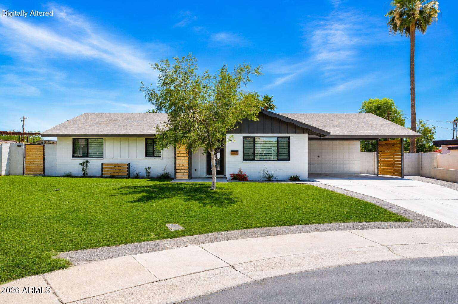 Over $250,000 was invested in this one-of-a-kind ground-up transformation by Deleigh of Southerly Enterprises, one of the Valley's most sought-after rebuild contractors known for her distinctive design aesthetic and uncompromising attention to detail. Every system and every finish in this home has been rebuilt from the ground up and it shows.
Situated on an oversized 11,500+ sq. ft. cul-de-sac lot on the Tempe/Scottsdale border with NO HOA, this 4 bedroom, 2 bathroom home delivers 12-foot ceilings with exposed beams, European walnut cabinetry, and a designer kitchen built to impress. The spa-inspired bathrooms, custom closets throughout, and resort-style backyard with a rebuilt pool complete a package that simply cannot be replicated in this market. Unlike typical remodels, every major system was replaced to create lasting value and peace of mind: New 5-ton HVAC with all-new ductwork, R-38 spray foam insulation, full electrical rewire, all-new underground plumbing, energy-efficient windows, and more. new HVAC, plumbing, electrical, and insulation were completed as part of the full rebuild, giving the next owner the beauty of a custom home with the peace of mind of new construction. 
Steps from Papago Park trails and just 10 minutes from Old Town Scottsdale. With the right offer, the seller, who is also the contractor, will build a garage for the buyer within 2 weeks of closing, a rare opportunity to customize this home even further.
This is not a flip. This is a vision executed at the highest level. Homes like this do not come along often.