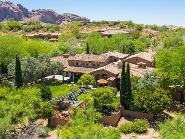 First time to market, this 7334 sf Furcini-built custom home is so much more than a home - it is a Rustic Mediterranean lifestyle designed and built by the All-Star lineup of: Furcini Construction, Mark Candelaria, Architect, Sandra Evans, Interior Designer, Peter Sevin Ironworks and more.  This home's seemingly rich and aged history disguises its comparatively recent 1999 construction. Finishes include Travertine, hand hewn beams, alder cabinetry doors and millwork, hand forged ironwork, custom lighting fixtures and imported architectural elements.  Constructed of the ''BLUE MAX'' I.C.E. block system of styrofoam block filled with concrete,  the builder was able to create extra thick walls