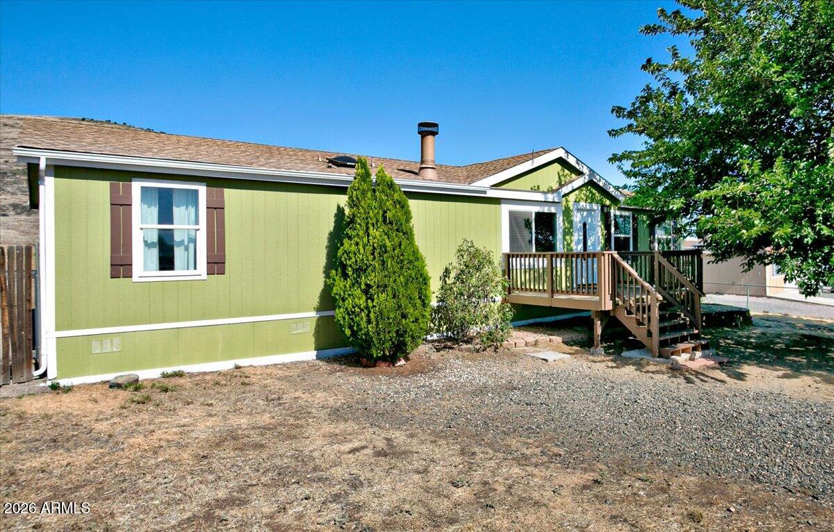 Charming and move-in ready, this freshly painted home offers a desirable split-bedroom layout. The spacious primary suite features a garden tub and separate shower, plus his and hers closets. A dedicated office nook with built-in desk and cabinetry provides the perfect work-from-home space. Outside, enjoy the brand-new front deck, abundant parking, fully screened in porch, and a generous backyard with room for play, pets, gardening, or recreational toys. Backing to Glassford Hill, the property enjoys attractive views and a convenient location close to everyday amenities. New roof within the past 5 years, and the home was leveled just last year. Affordable, inviting, and full of charm, this is one you'll want to see for yourself.