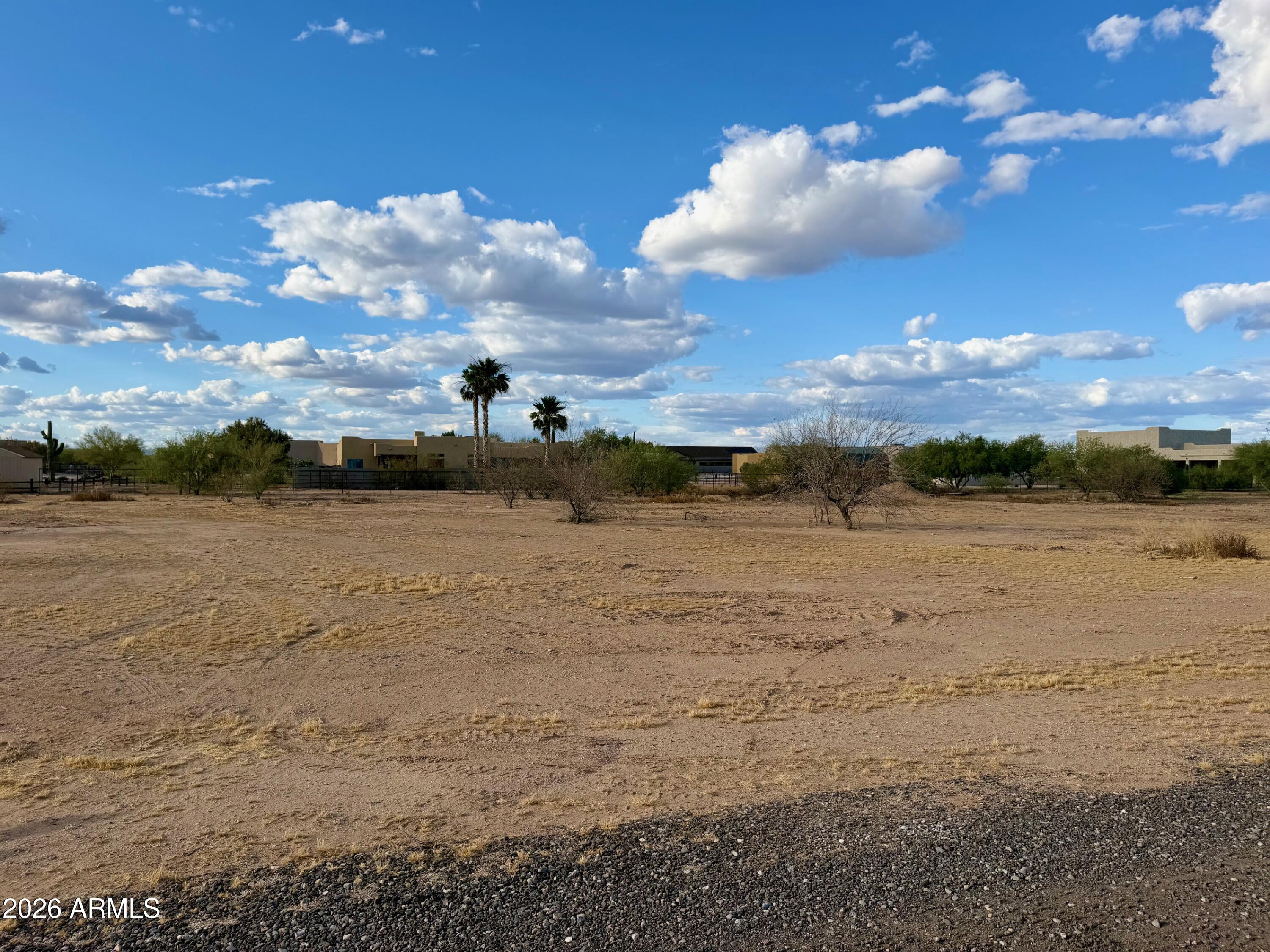 Exceptional lot, cleared and ready to go in the quiet community of Wittmann. Shared well in place. Electric at lot. No flood. No Luke AF APZ. Surrounded by new luxury custom homes. Room for spacious home PLUS RV garage PLUS guesthouse PLUS horses and all the toys. No HOA. Improved road and shared easement to parcels. EZ access to US60/Grand, the 303, Lake Pleasant, Shopping, Dining, and a quick trip to Vegas. Buyer to verify all info. Septic will be needed. Great opportunity for builder. Restricted to site-built homes only, no mobile/manufactured. Survey in Documents.