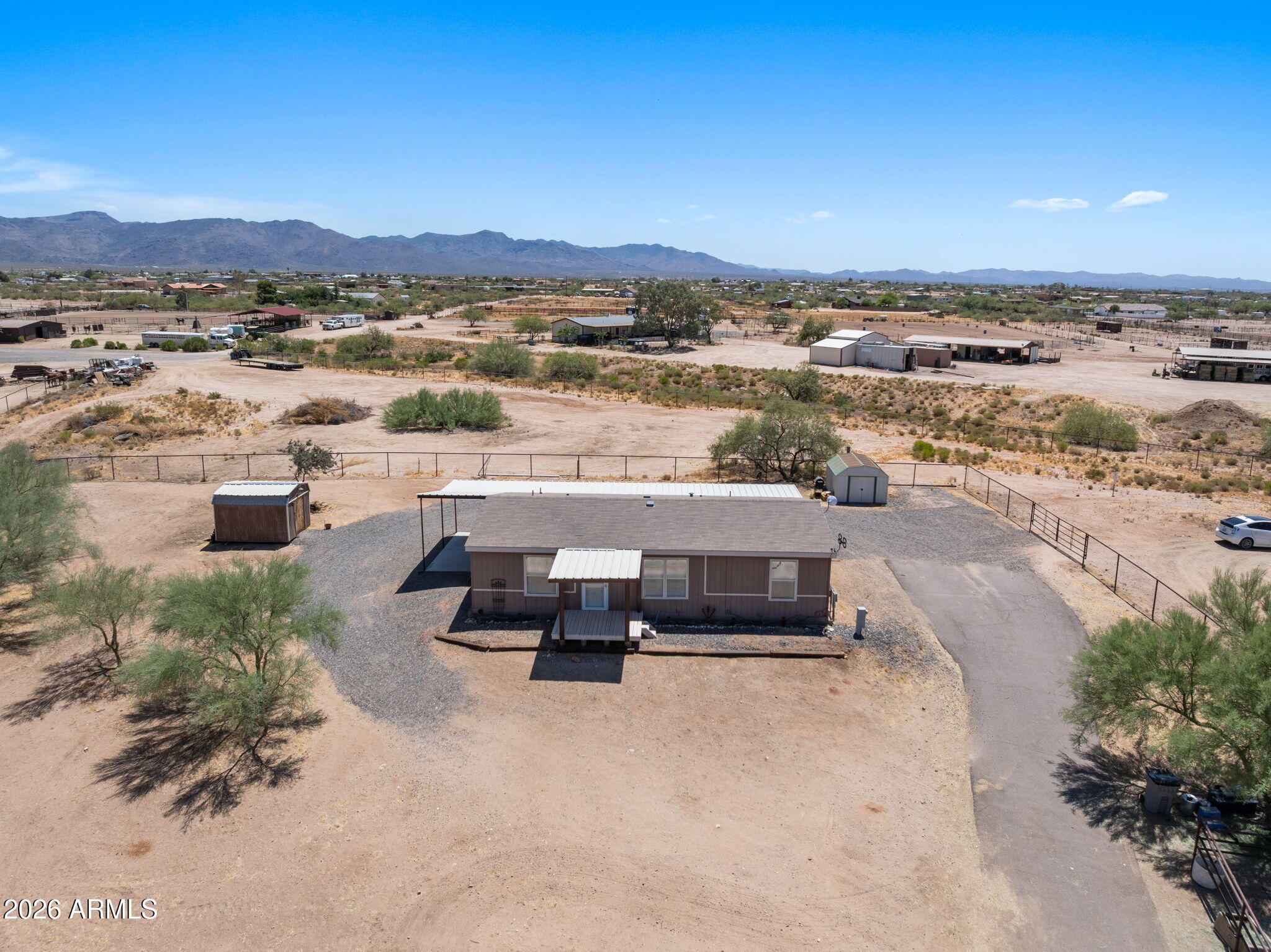 Easy living starts here. Tucked away in a quiet, safe neighborhood with paved road access, this well maintained 3 bedroom, 2 bath horse property is clean, turnkey and ready for you to move in and start enjoying from day 1. Conveniently located just minutes from Wickenburg and it's renowned arenas, you'll spend less time driving and more time doing what you love. The property features 2 spacious turnouts, dog kennels and 2 RV hook ups with both 50 and 30 amp service making it ideal for horse owners and winter visitors. Enjoy the back patio while taking in the beautiful mountain views and desert sunrise. Best of all, the home is being offered mostly furnished allowing you to move right in and start enjoying everything this property has to offer. Whether you're looking for a full time residence or a low maintenance winter property, this one definitely checks all the boxes.