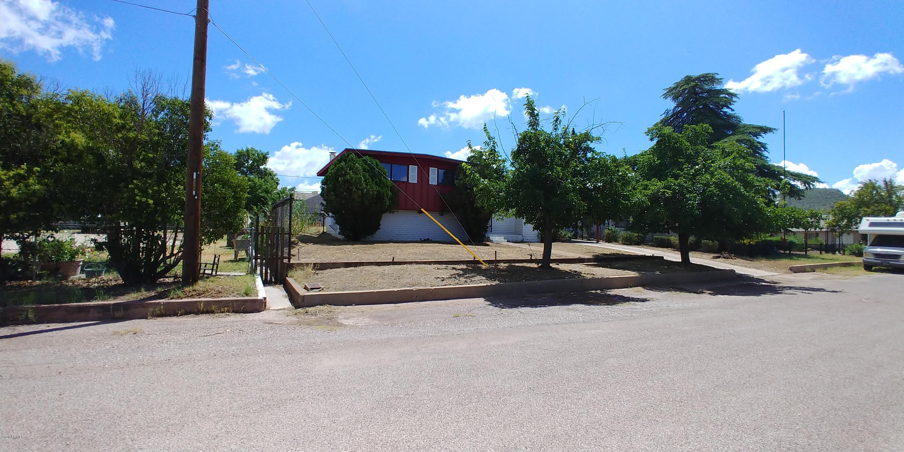Here is a great opportunity to purchase a home just off the Vista and across from Greenway School. This split entry home has the mster suite taking up the entire lower level.  There is a big walk in closet as well as under stairs storage in the basement level. On the main level, there is a good sized living room with a gas fireplace, good sized kitchen and nook as well as a family room and bath. Upstairs there are 3 bedrooms. Out back, there is an old pump house building (pump is gone) that is really cool and also a small shed. There is a fenced yard as well. This is an AS IS sale. The seller will NOT be making any repairs and the price reflects the condition of the home. This will not last at this great price!