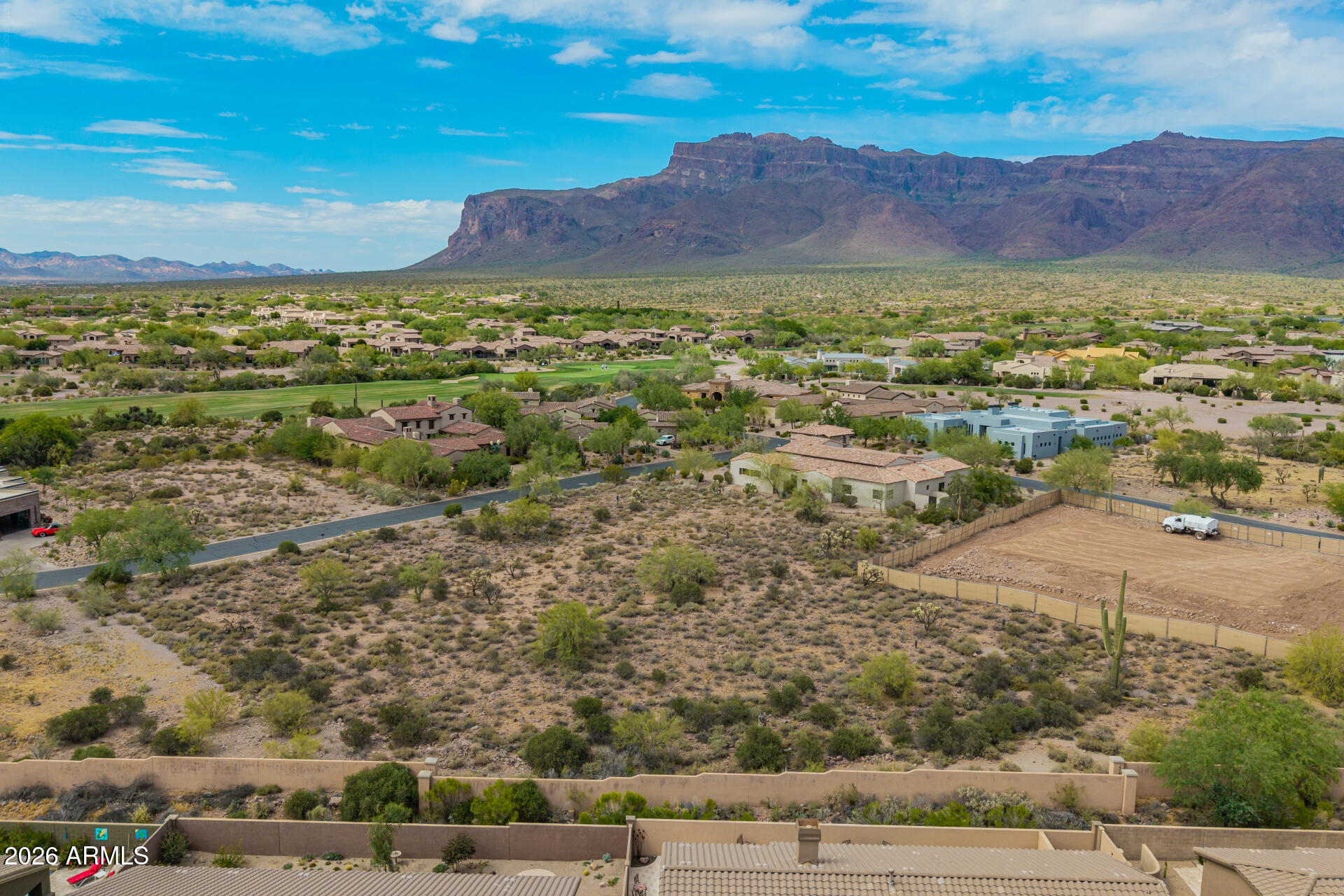 Wonderful SUPERSTITION MOUNTAIN views from this .50-acre homesite in Superstition Mountain Golf & Country Club in beautiful Gold Canyon, Arizona's best kept secret! This is an easy build, flat lot in the Village of Lost Gold Estates surrounded by stunning custom homes!  There is NO REQUIRED BUILD TIME, purchase soon and plan your future dream home when you are ready. THE LOT NEXT DOOR IS ALSO AVAILABLE TO EXPAND TO A FULL ACRE HOMESITE. Minimum home size in Lost Gold Estates is 3000 sf. Private and serene setting awaits, two 18-hole premiere golf courses, fitness center, tennis and pickleball, bocce ball, nearby hiking, walking trails and more. When you enter these gates, it feels like home! Come see all this area has to offer, you'll be happy you did! Membership options are available under separate agreement.