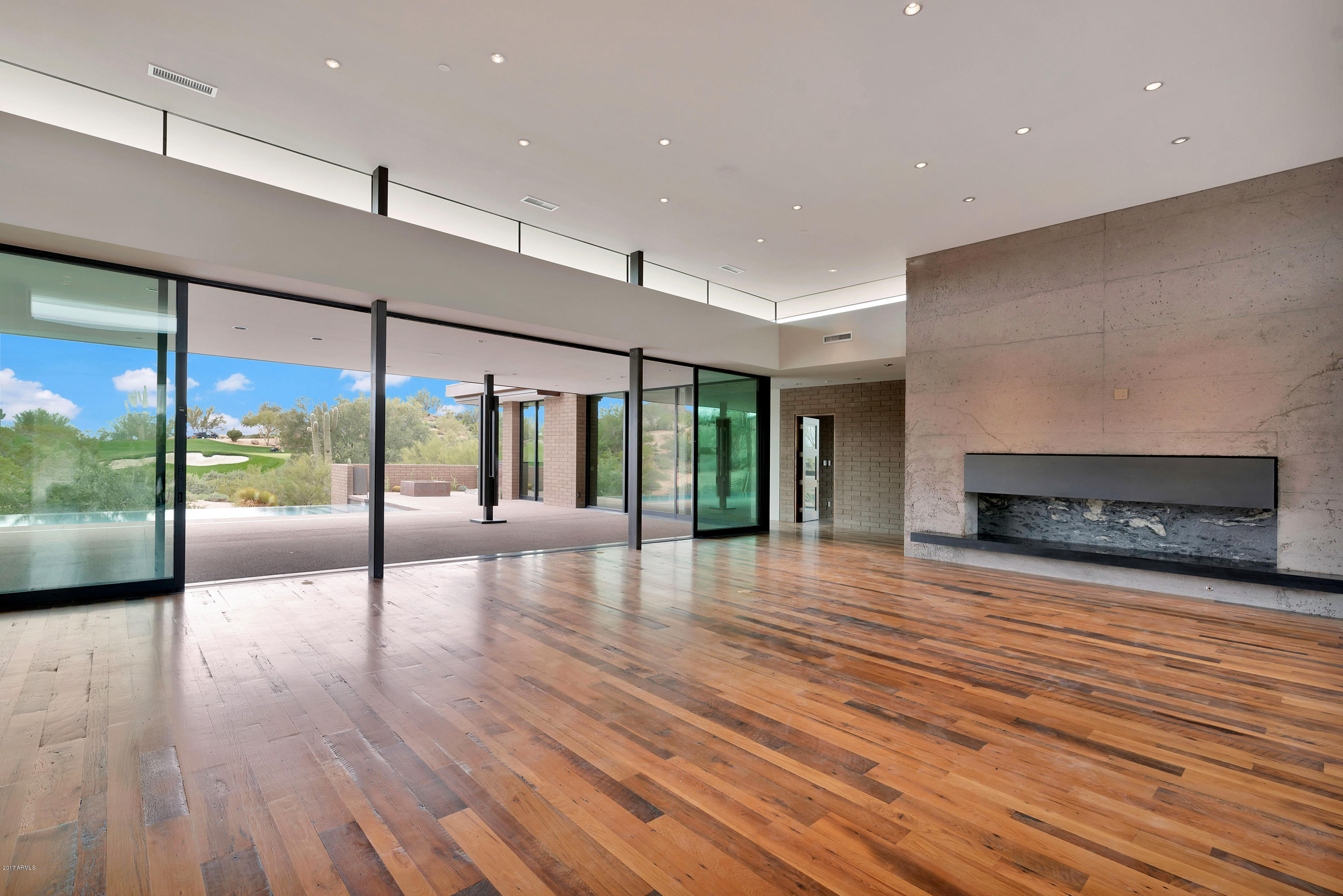 Brand new contemporary show stopper on the 17th green of Estancia. Single level with very private knock out views of golf course, Pinnacle Peak, and stunning desert. Massive poured in place concrete fireplace in open plan great room. Walls of windows that stack and open at the touch of a button. Gourmet kitchen with double ovens including one steam. Reclaimed white oak flooring, quartzite counters, Walnut doors. Macassar Ebony cabinets. Temp controlled wine cellar. 4 bedrooms + small flex room or office. Must see and be dazzled!