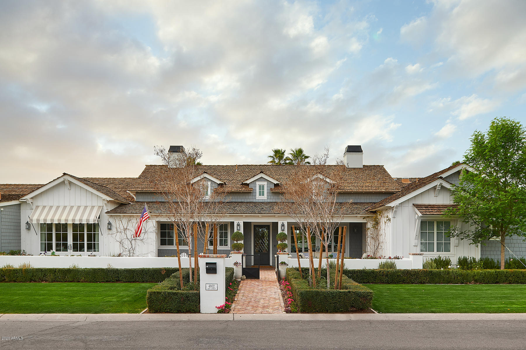 Looking for the perfect jewel box in the heart of Arcadia?? Here it is! Super custom home built by the incomparable Rafterhouse and recently featured in Phoenix Home and Garden! Not a detail overlooked or expense spared in this refined 4 bedroom / 3.5 bath + office home.  The highest of finish quality.... from the wide planked oak floors throughout to the hand crafted millwork and trim details. Open great room concept with soaring trusses and a disappearing wall of glass that opens onto the lushly landscaped backyard. A kitchen that's as pretty as it is functional... with Wolf / Sub Zero appliances, custom cabinetry, Waterstone fixtures and a walk in pantry with signature rustic pantry door.  One of the most delightful master suites you'll find with vaulted ceilings and a beautiful marble bath with dual vanities, claw foot tub and coffee station. Refined Gardens pulled out all of the stops with the landscaping here... not a square foot wasted from the charming Old Chicago brick patios and sparkling pool to the rear yard ramada with fireplace and built in bbq, the outside lives as warmly as the inside.  Charming garden with stunning Camelback Mountain views and antique sink sits off to the side for privacy and usability.  Just too many details to list... you won't regret seeing this special home!